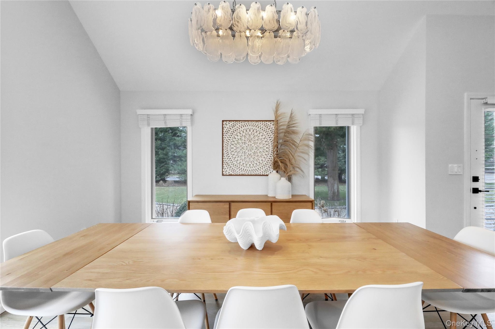 Dining space featuring healthy amount of natural light and lofted ceiling