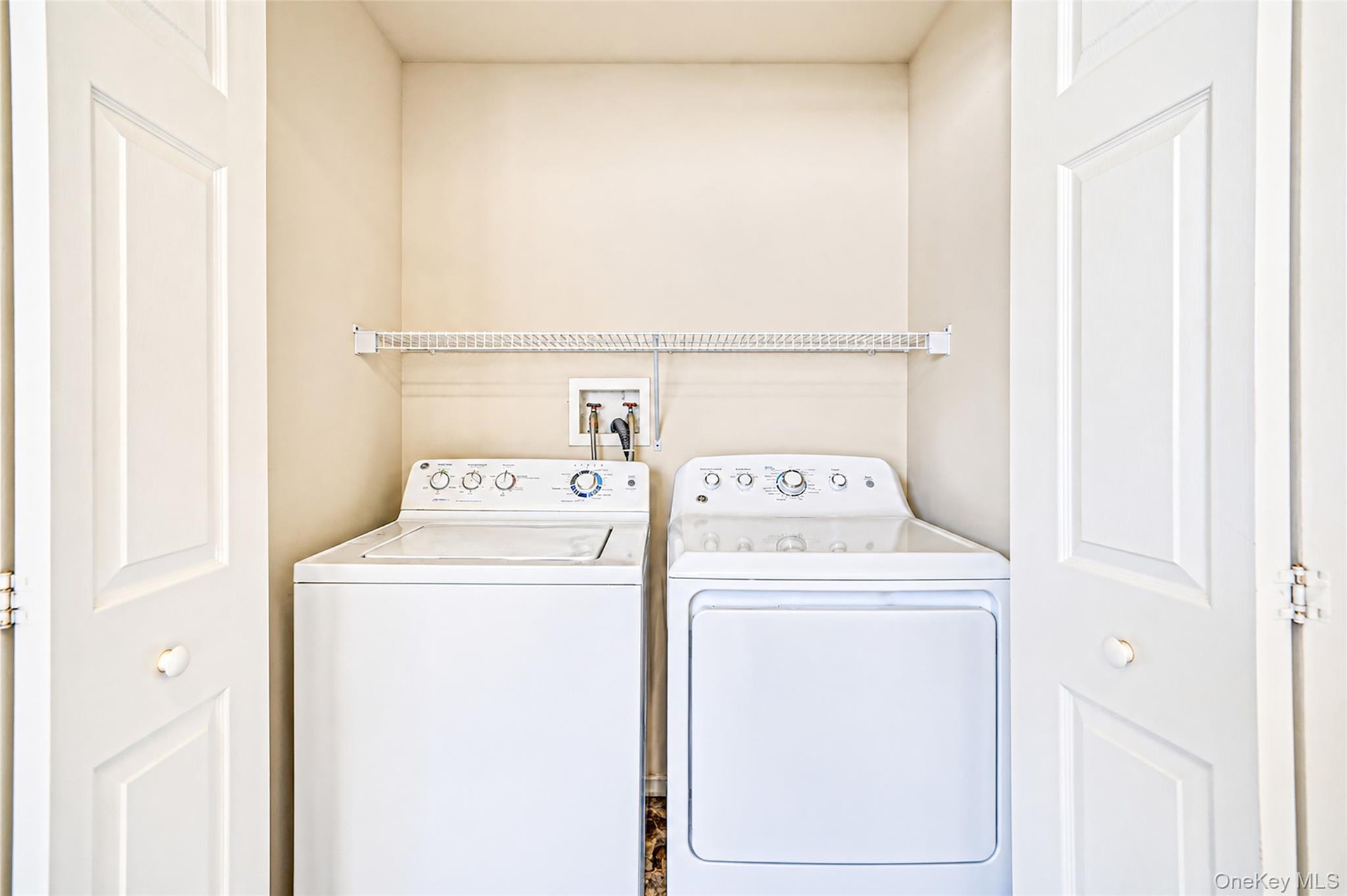 Second floor laundry area virtually decluttered