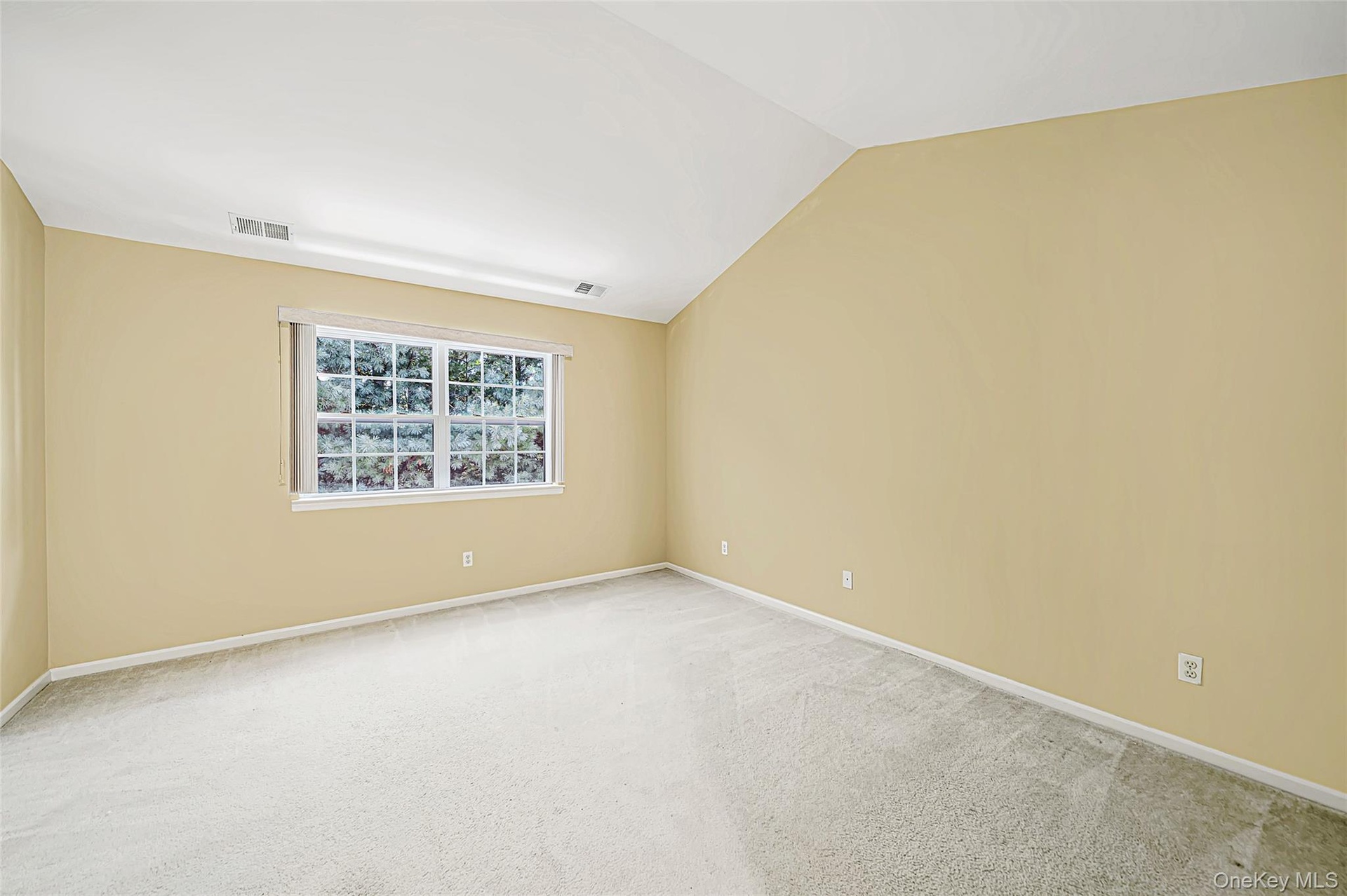 Primary bedroom with walk in closet and en-suite bathroom
