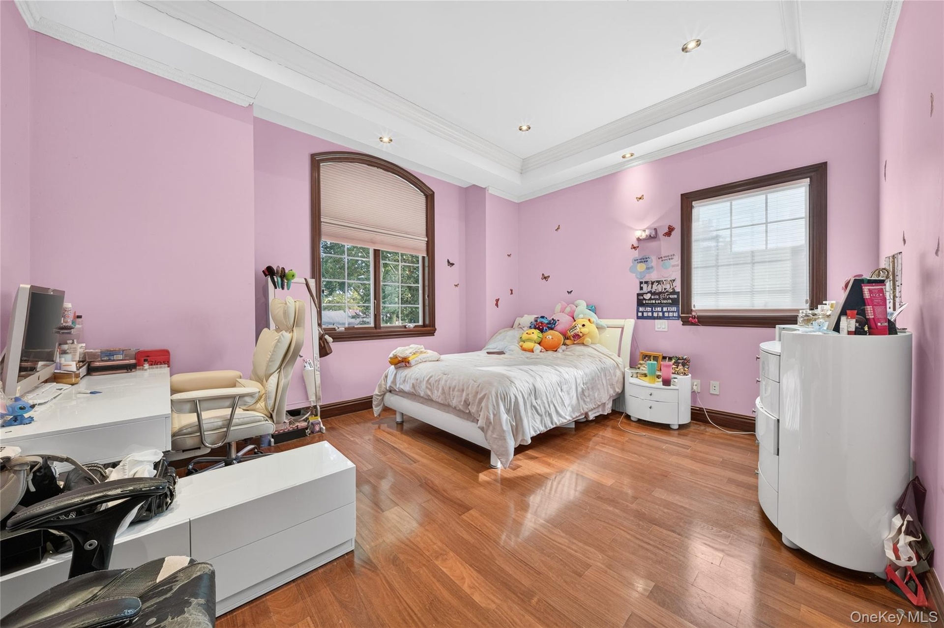 Hardwood-finish flooring throughout, recessed ceiling lighting, and crown molding