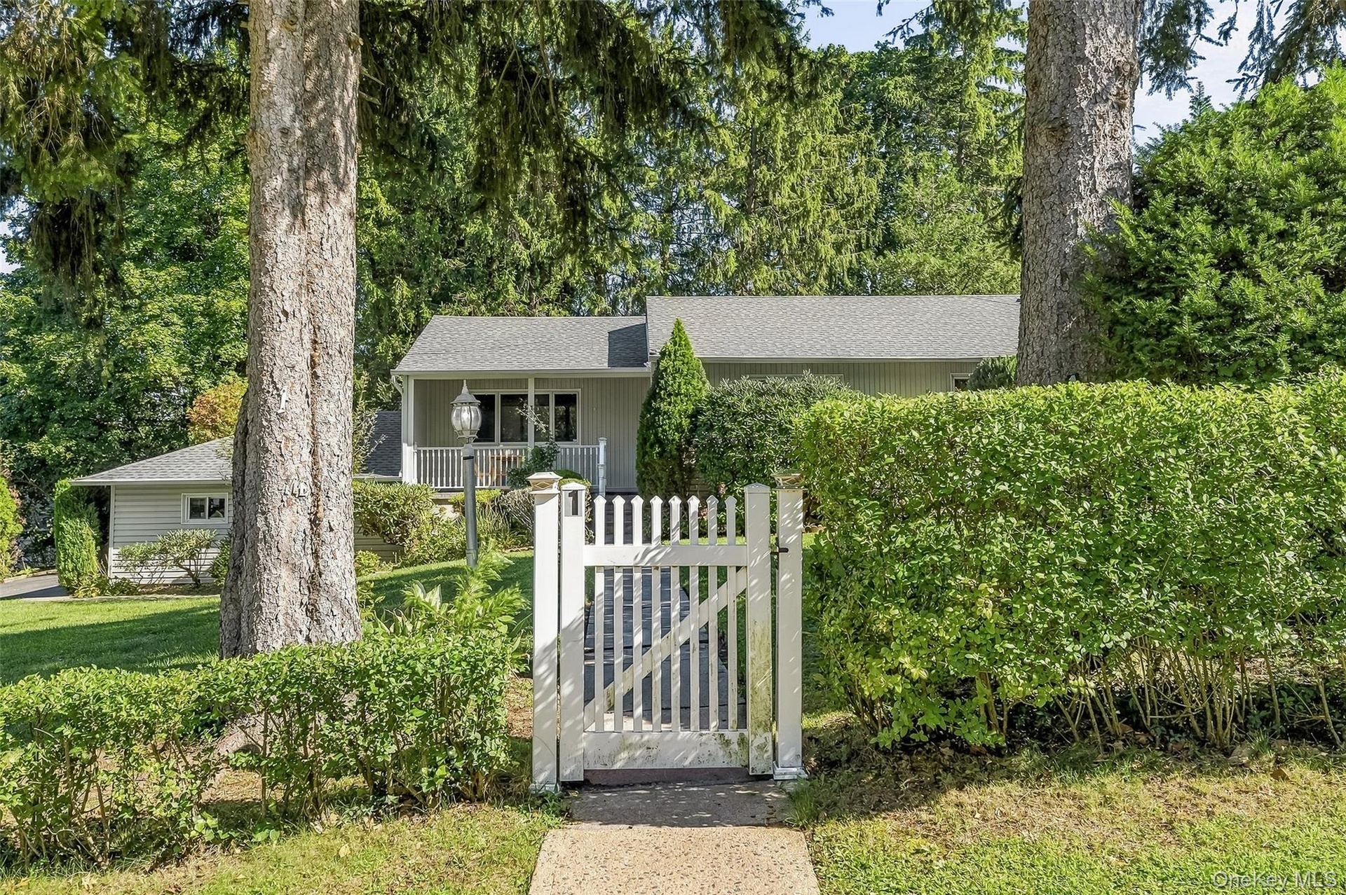 Private, level grounds surround the home