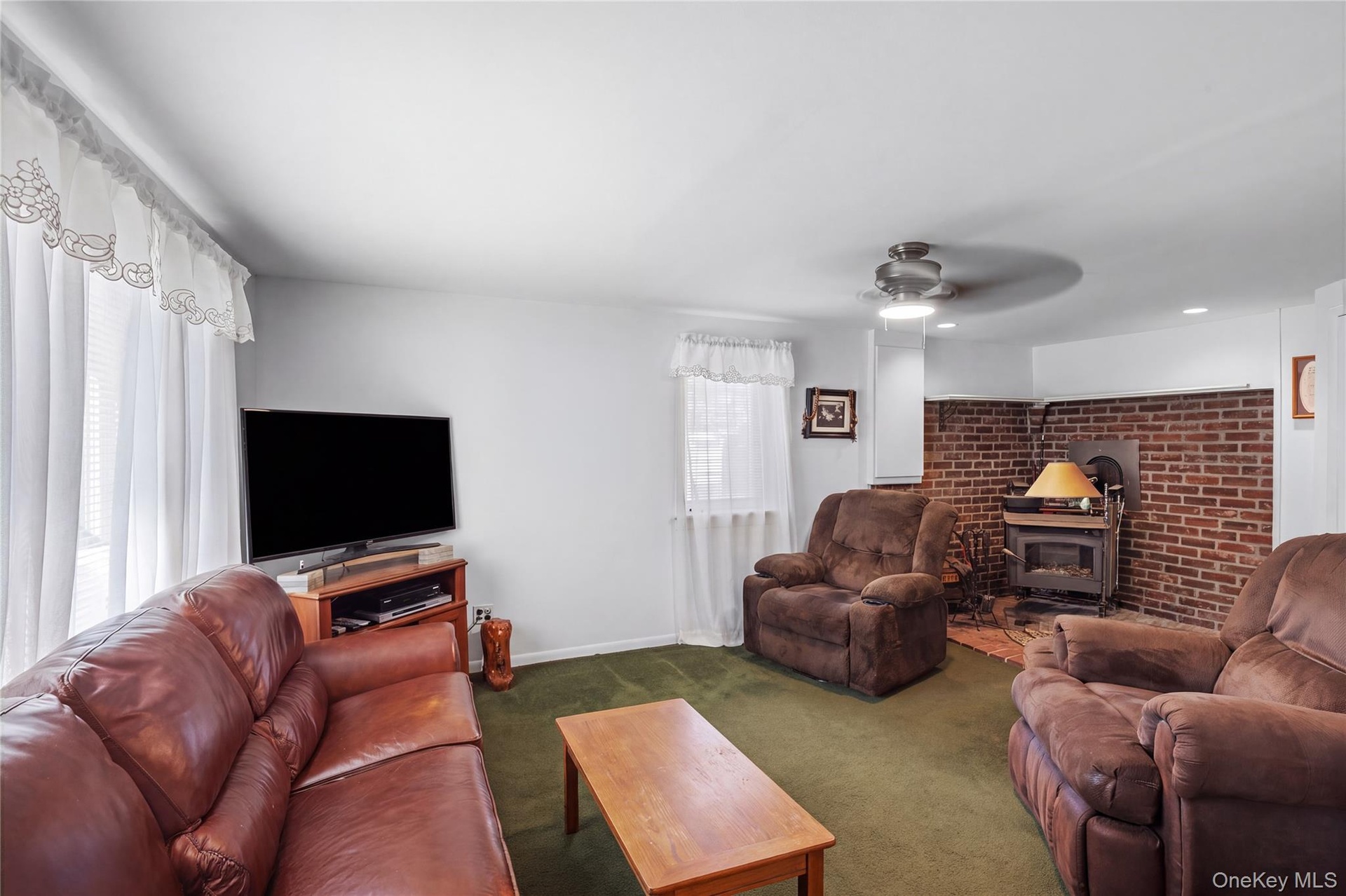 Converted garage, den with wood burning stove