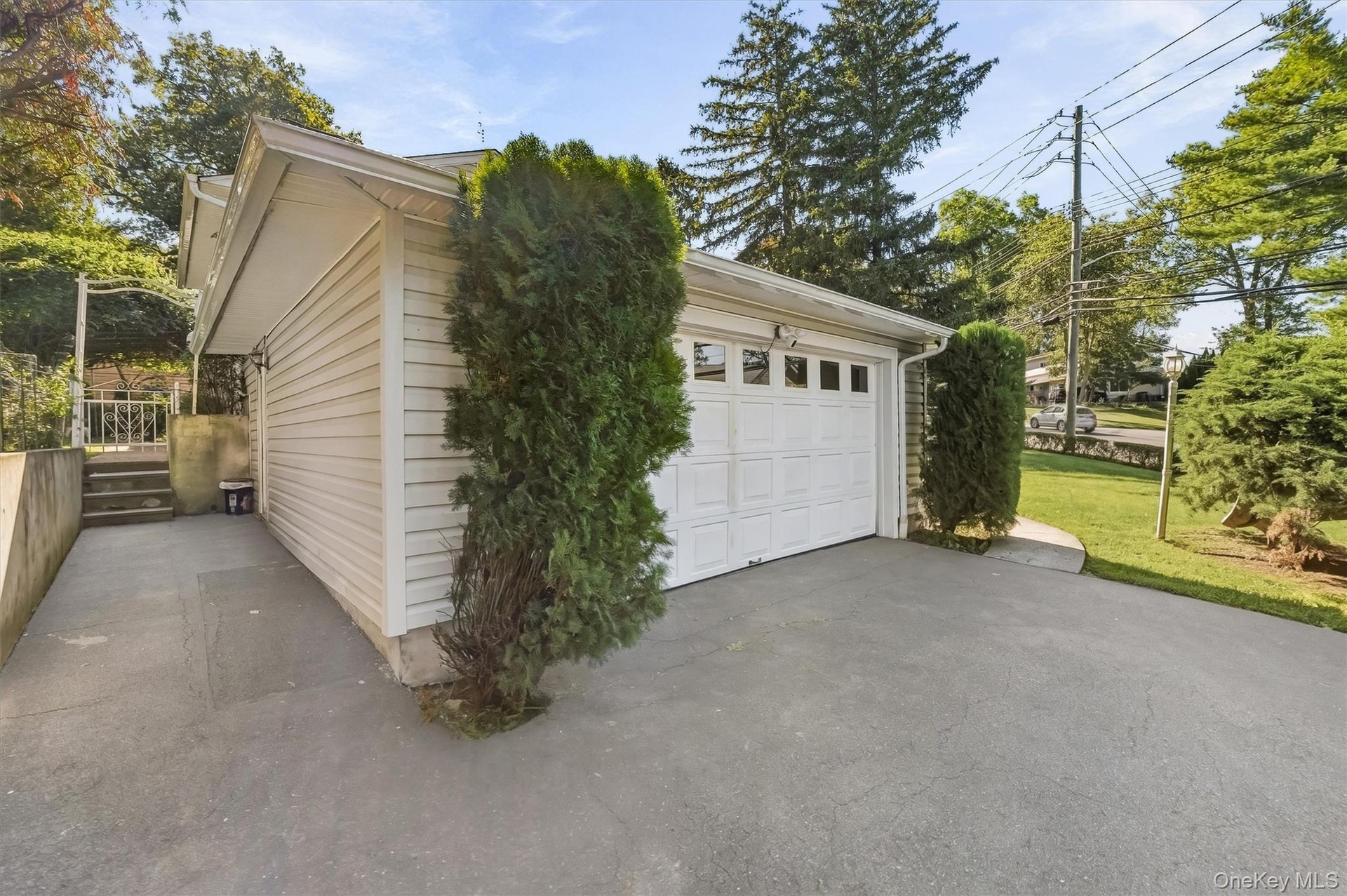 A generous driveway leads to the garage