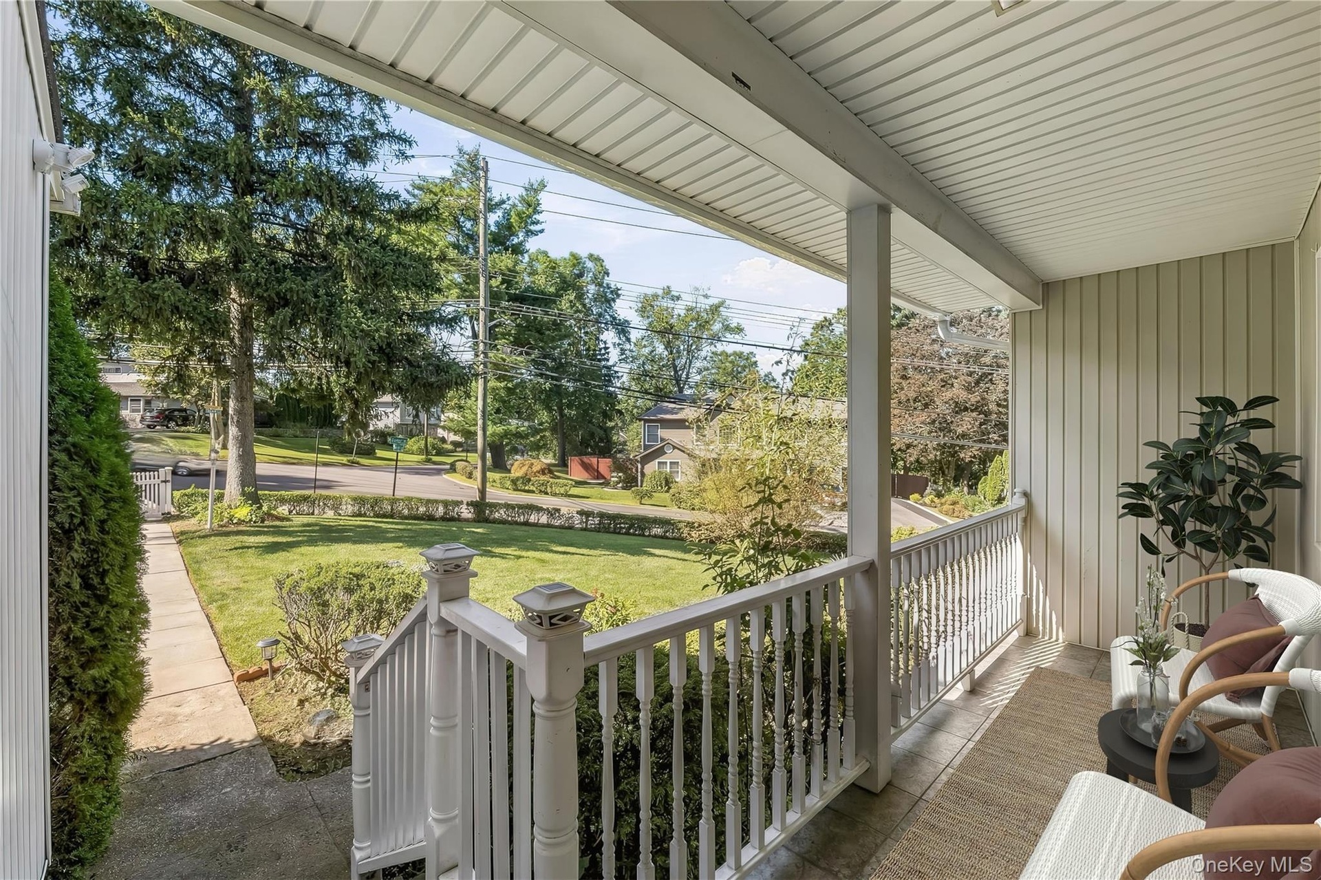 Enclosed Front Porch, a welcoming presence.