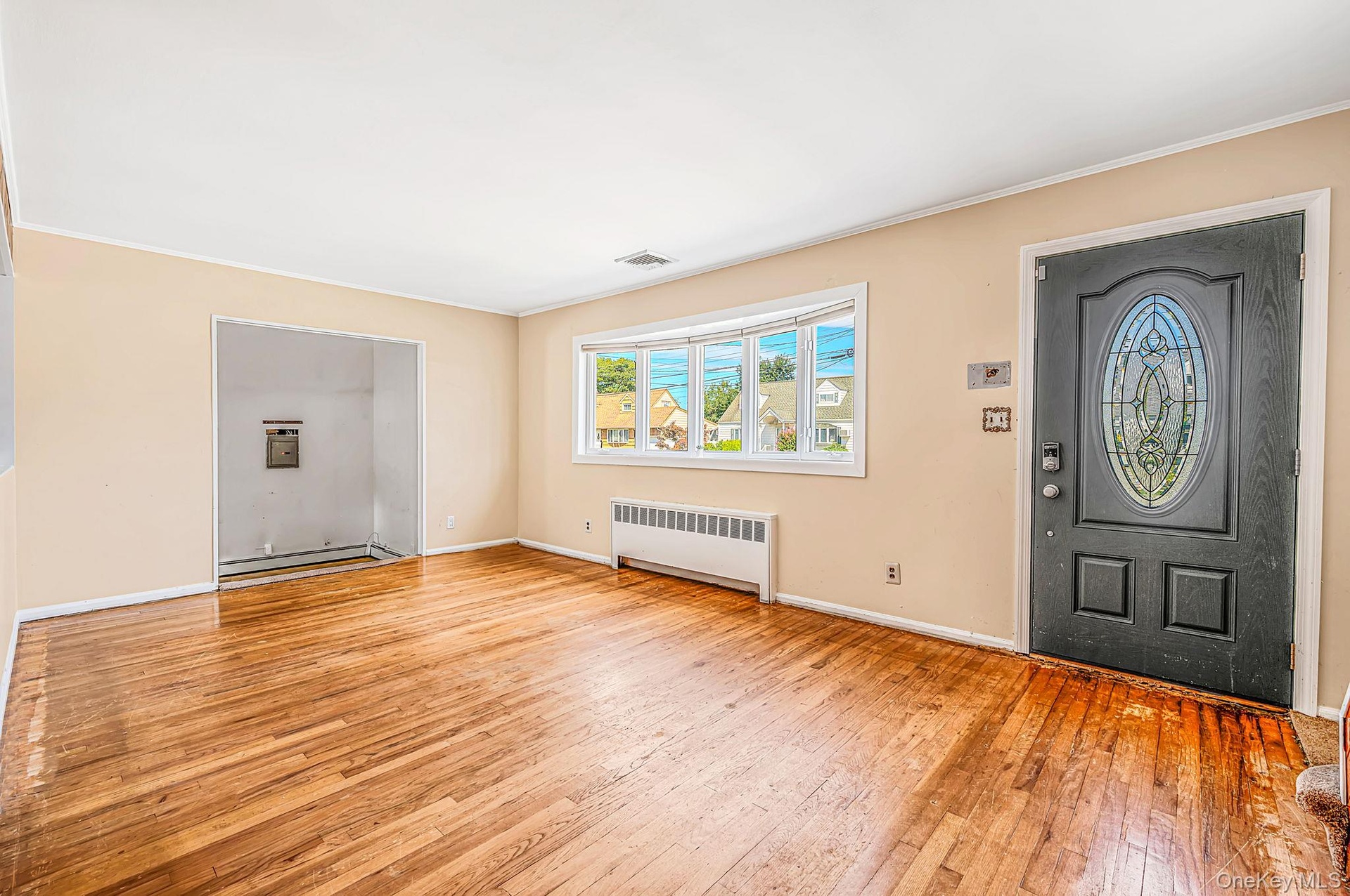 Spacious LR with HW Floors, Tons of Natural Light