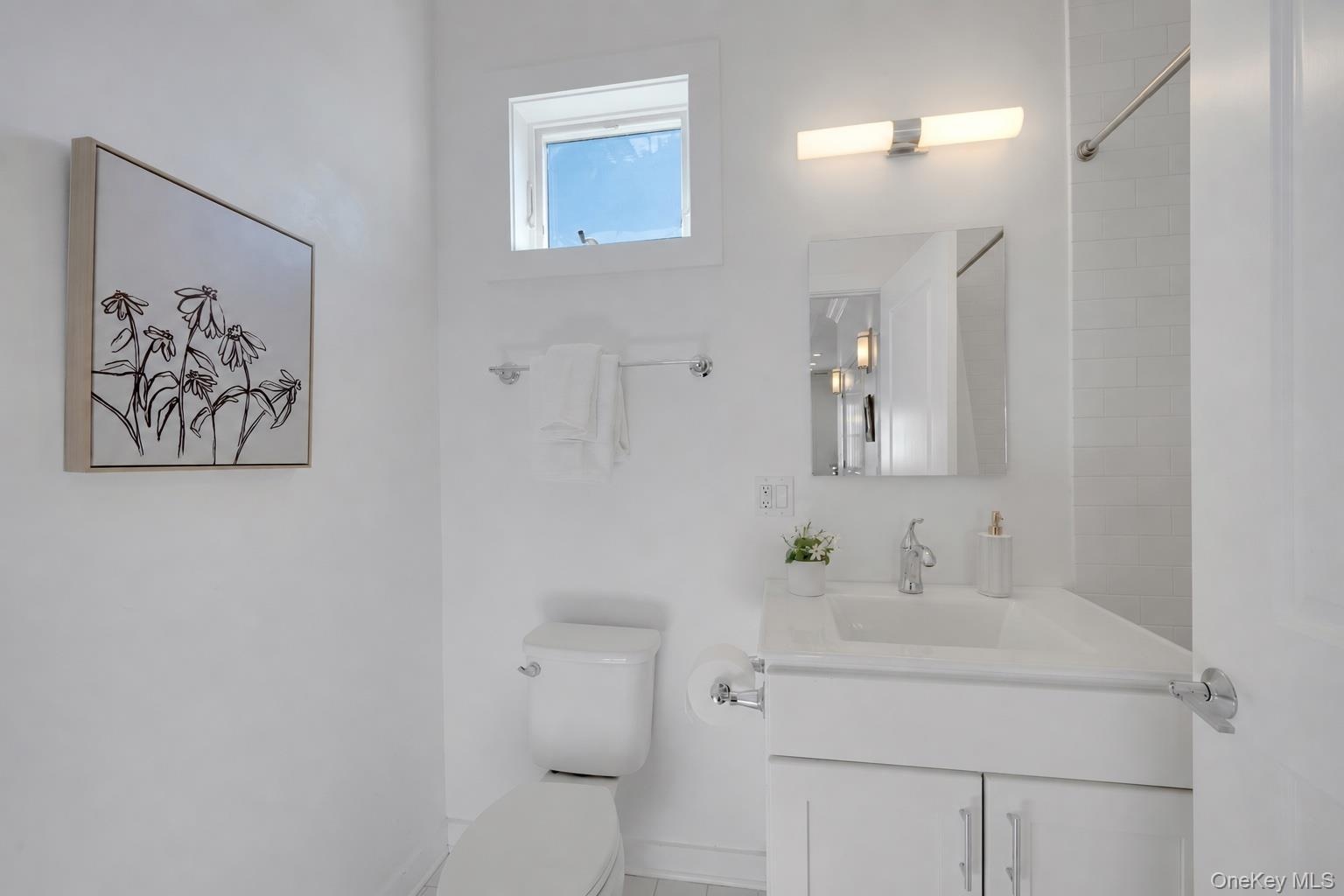 Third full bathroom  conveniently located in the hallway outside the third bedroom.