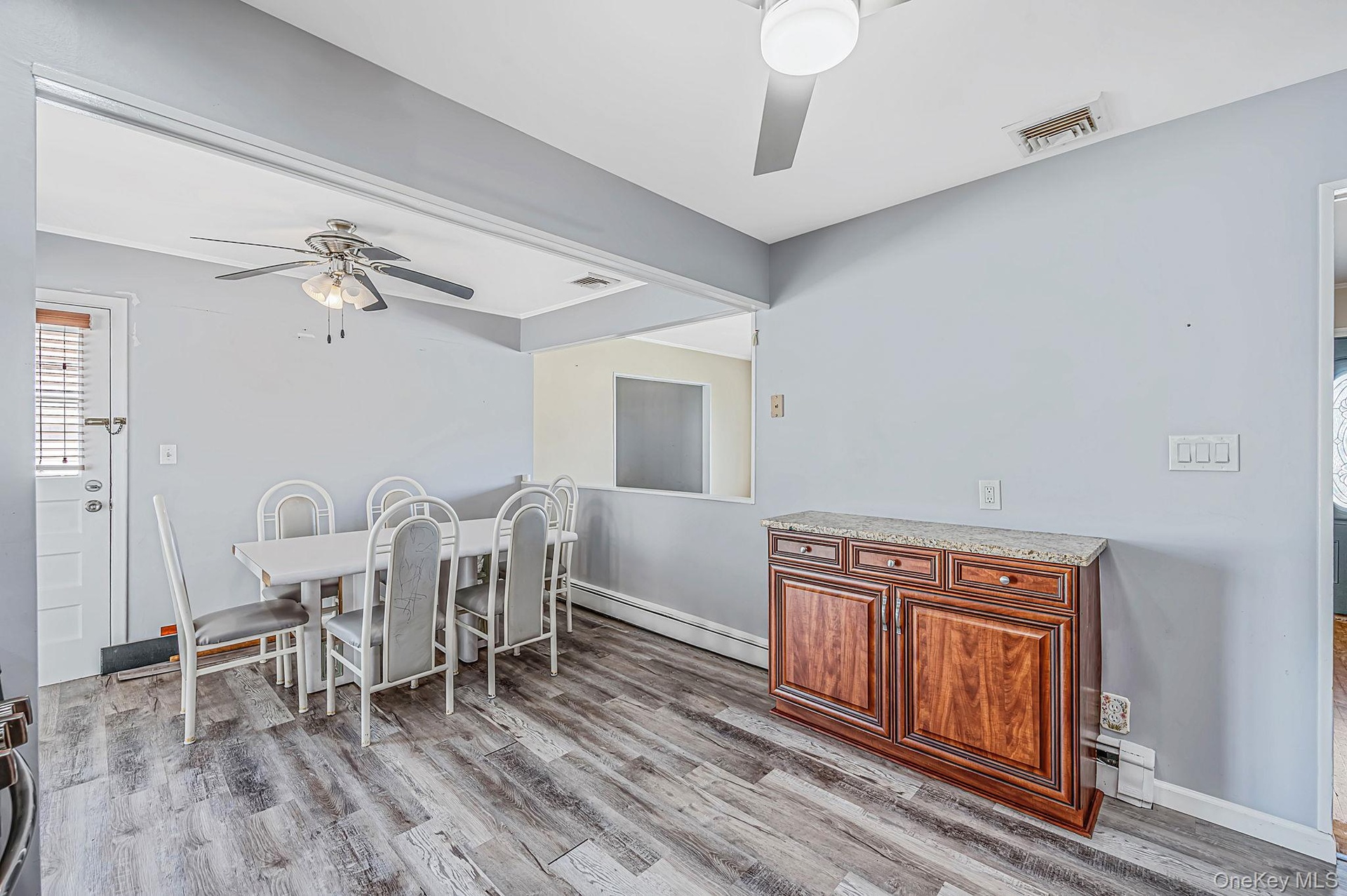 Updated EIK with SS Appliances, Gas Cooking, Large Dining Area, Sliders to Sunroom