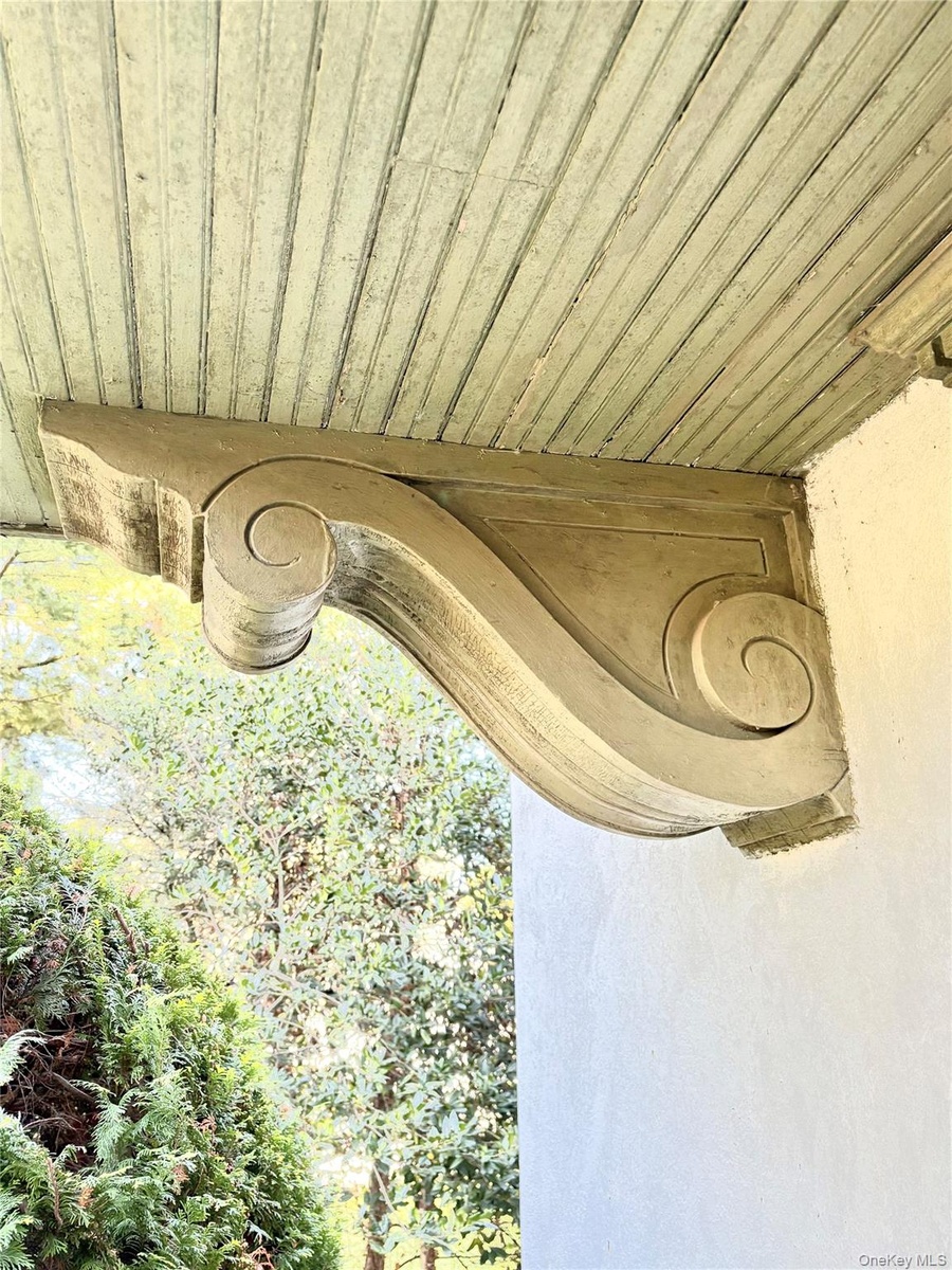 Front Entrance. substantial wood brackets and deep projecting hood fit nicely with Arts & Crafts/Craftsman detailing.