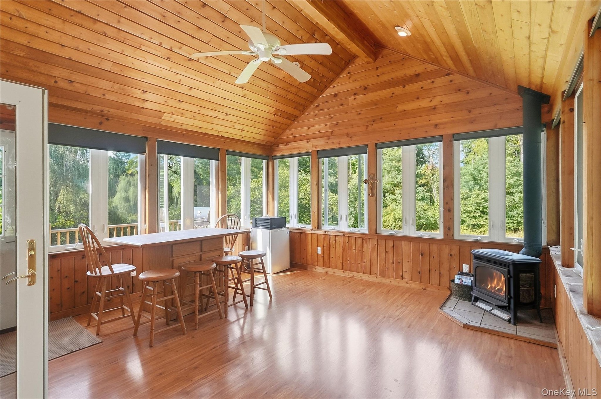 Cozy room full of windows to enjoy the NY seasons