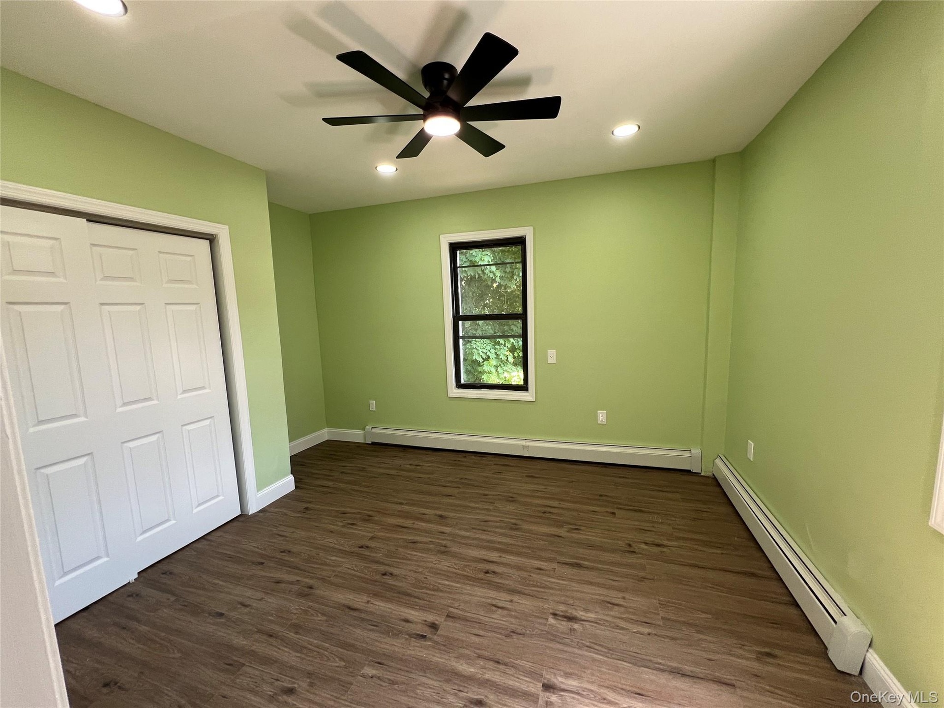 Bedroom #1 2nd floor featuring wood-finish flooring, a black ceiling fan, and recessed lighting