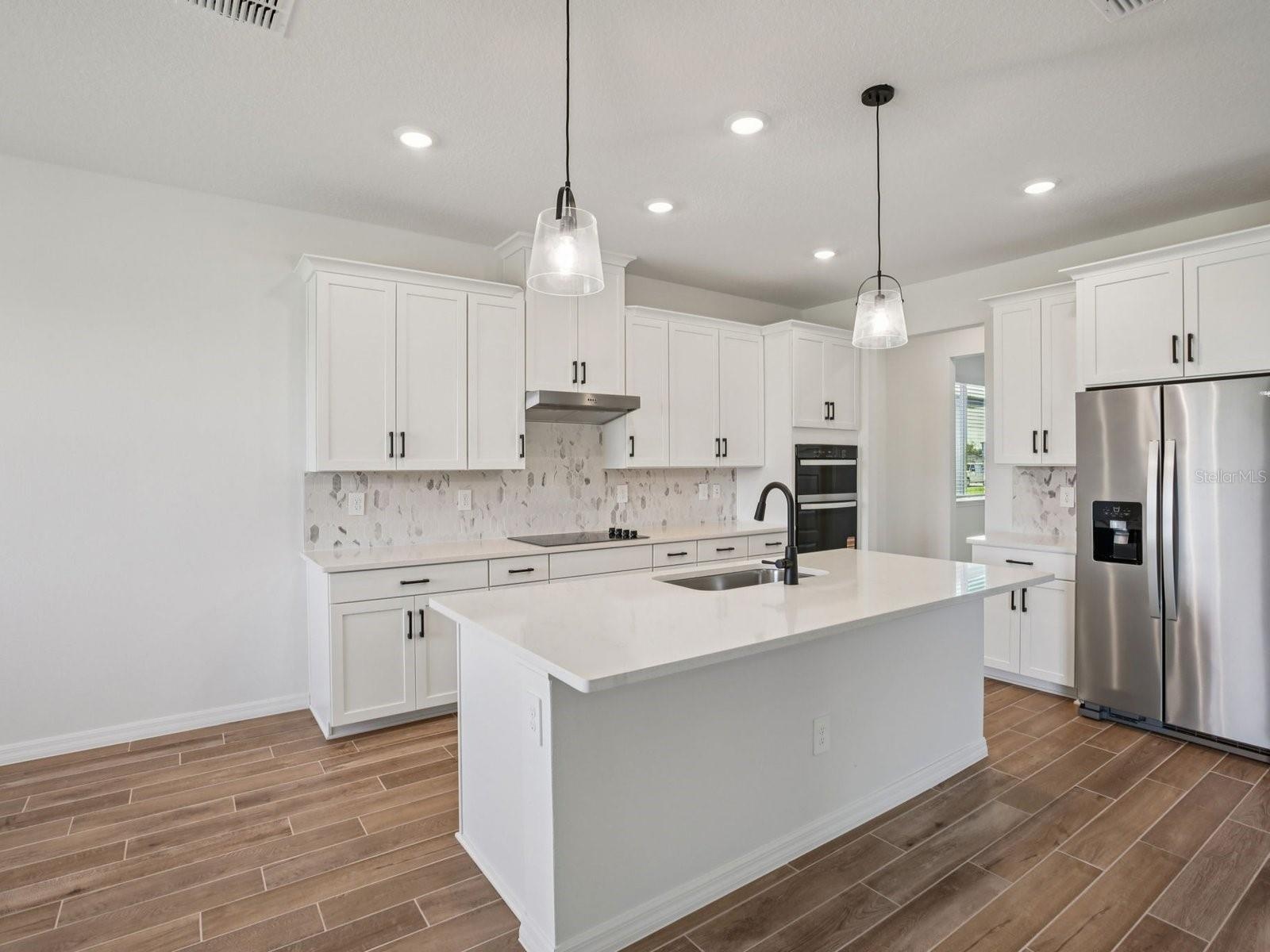 Photo is not of the actual home, but is an inspirational photo of builder’s model home and may depict options, furnishings, and/or decorator features 