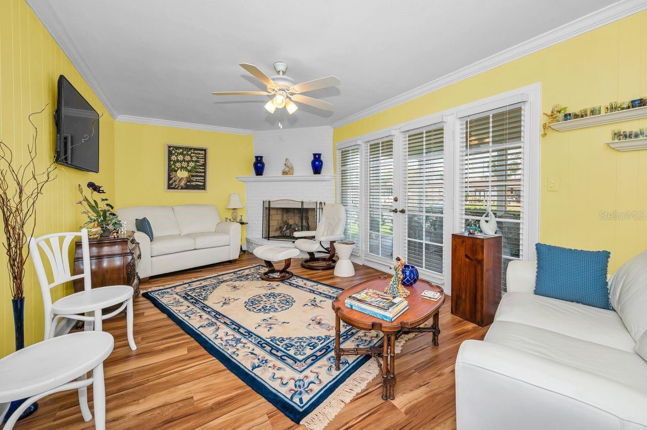 Separate family room with a fireplace and lanai entrance