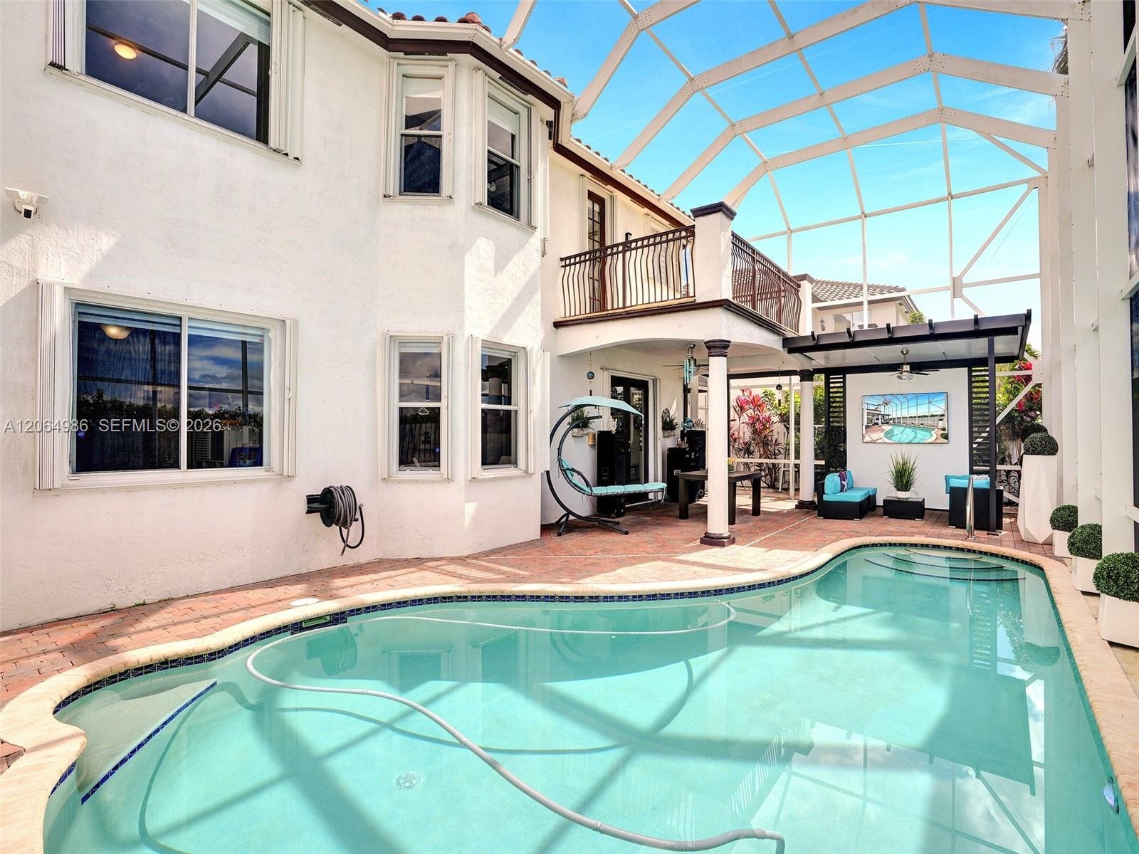 SCREENED POOL WITH COVERED PORCH, GAZEBO WITH LIGHTS, CEILING FAN, TV HOOKUP. MASTER BEDROOM BALCONY OVERLOOKING POOL AND CORN FIELD FOR BEAUTIFUL SUN