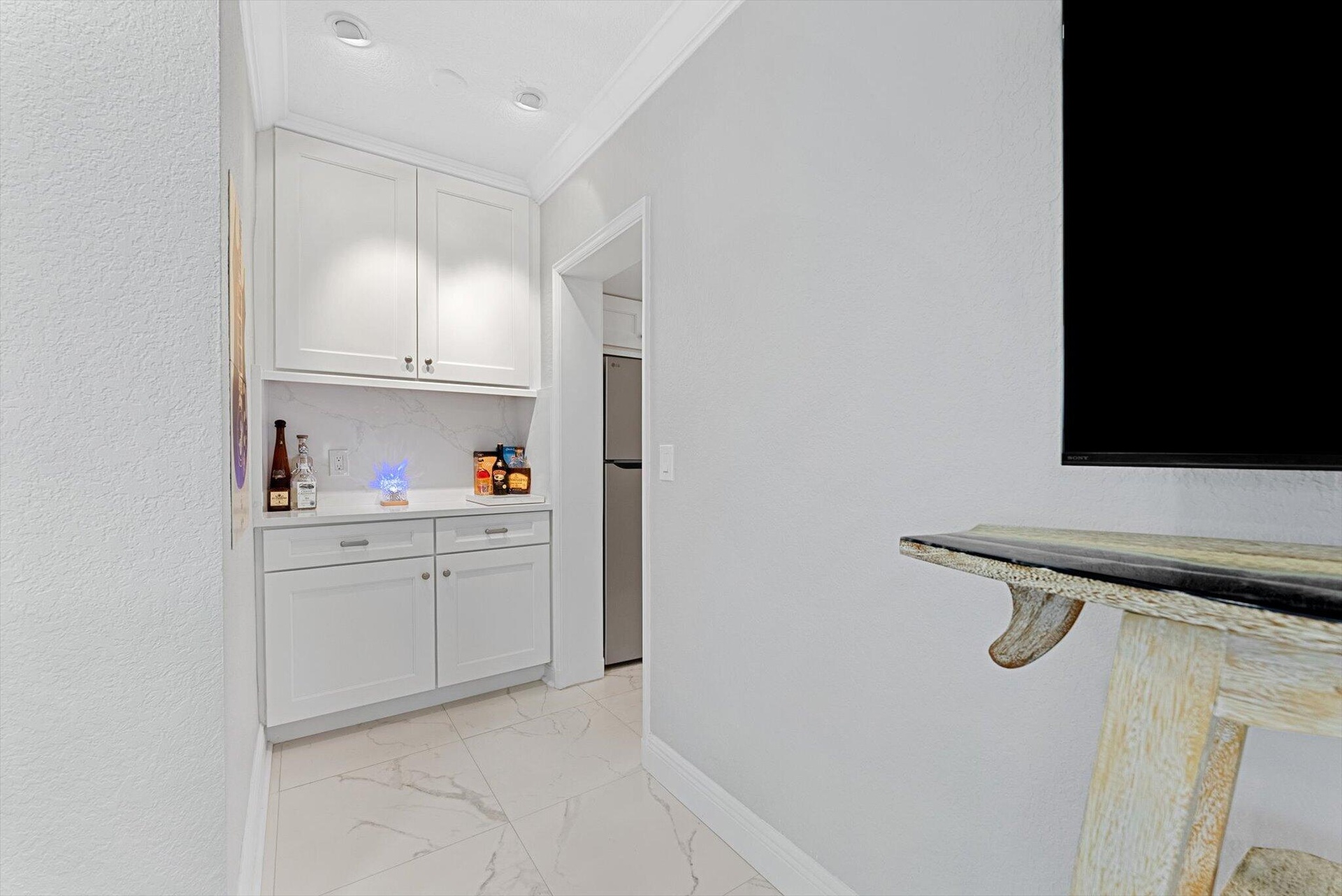 Built-in bar and storage unit.