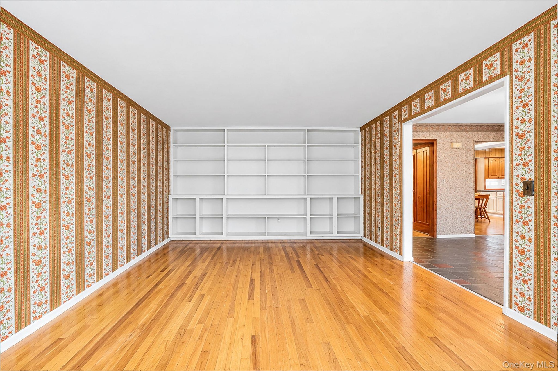 with hardwood floors and bookcases