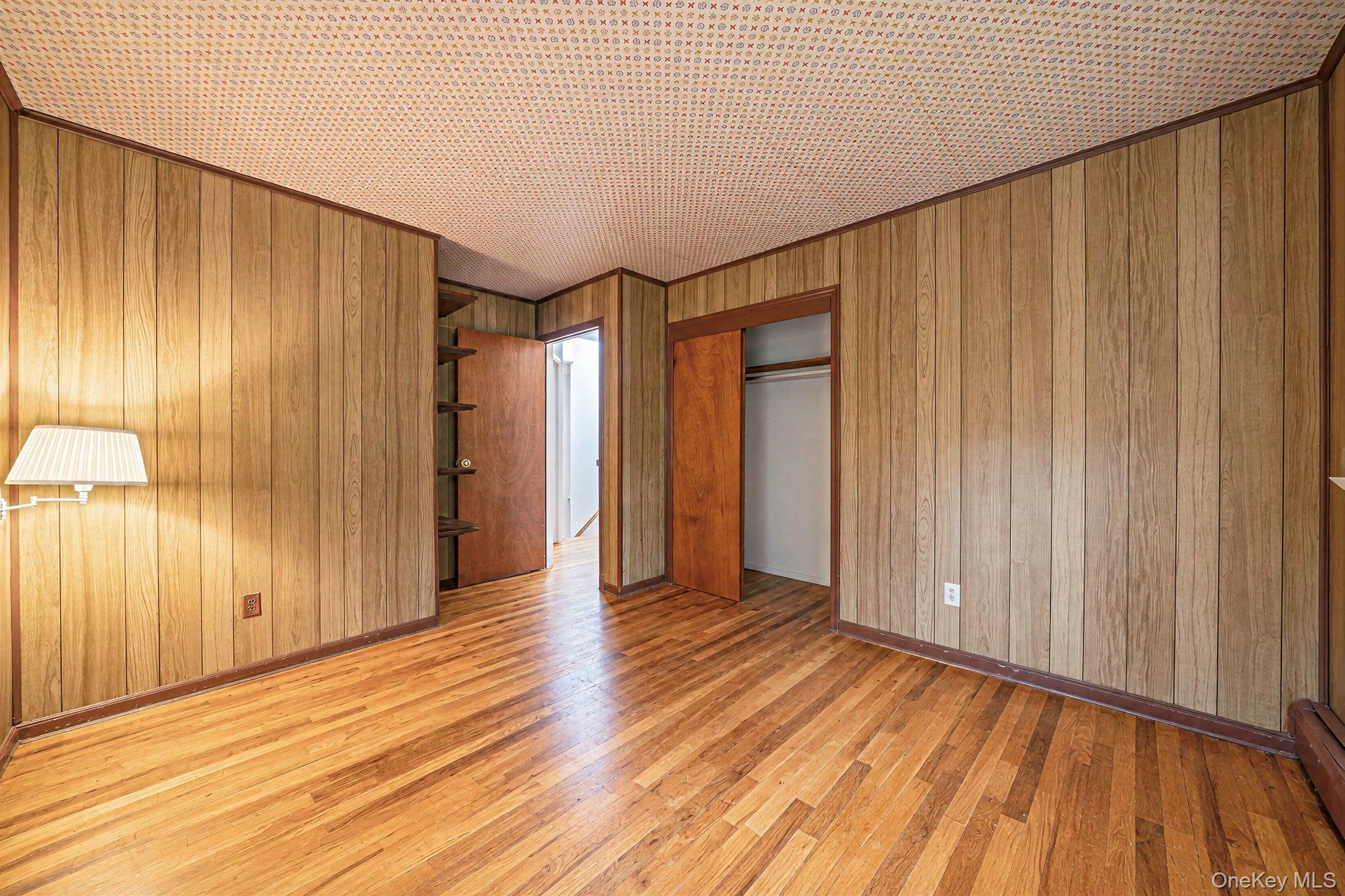 bedroom with hard wood floors