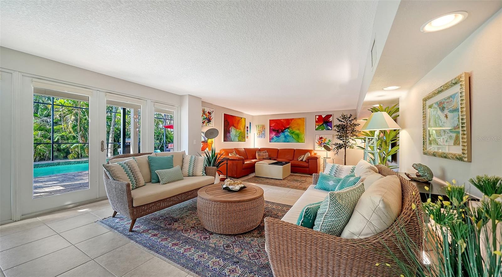 Large family room with direct access to the screened pool and lanai.