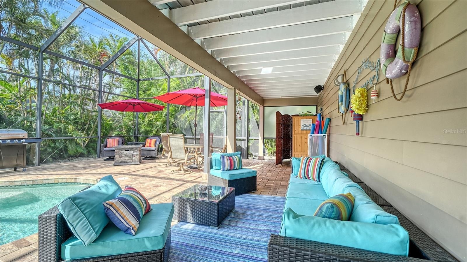 Covered poolside seating creates a comfortable shaded retreat.