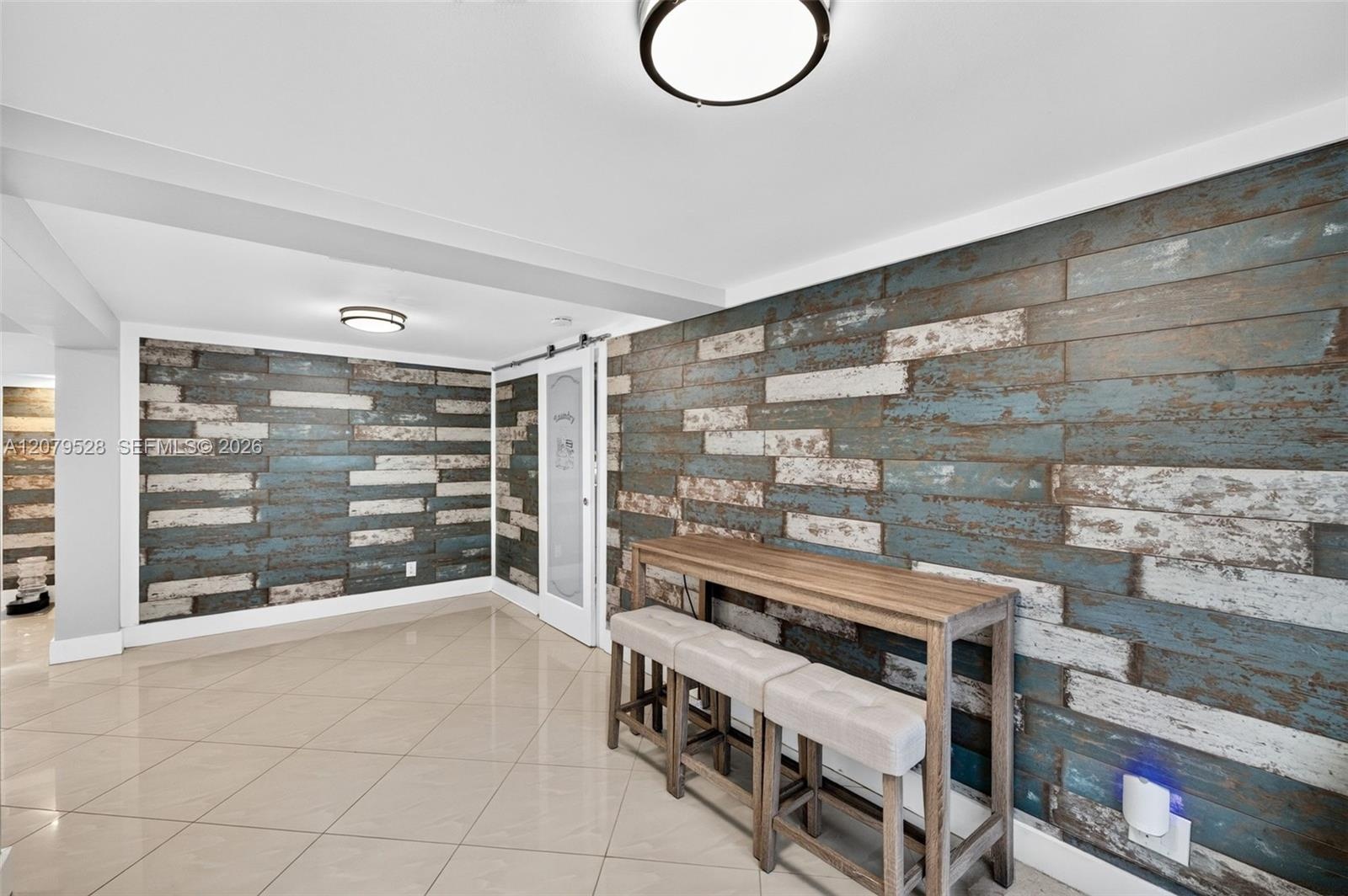 Great room or Dining Room downstairs, off kitchen, beyond this space are doors to front of house. Come right in here w/ your groceries. Beachy paneled