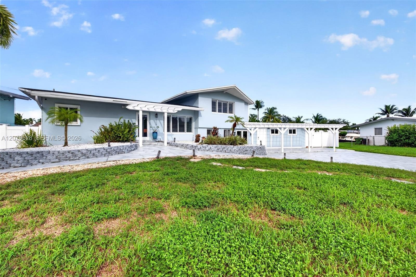 Oversized stamped concrete driveway with oversized wide lot as well