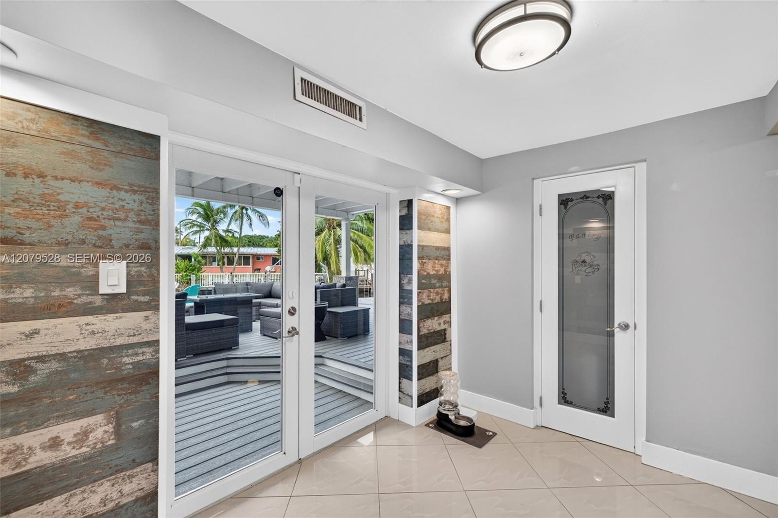 Open kitchen, beyond this space are french doors to pool deck