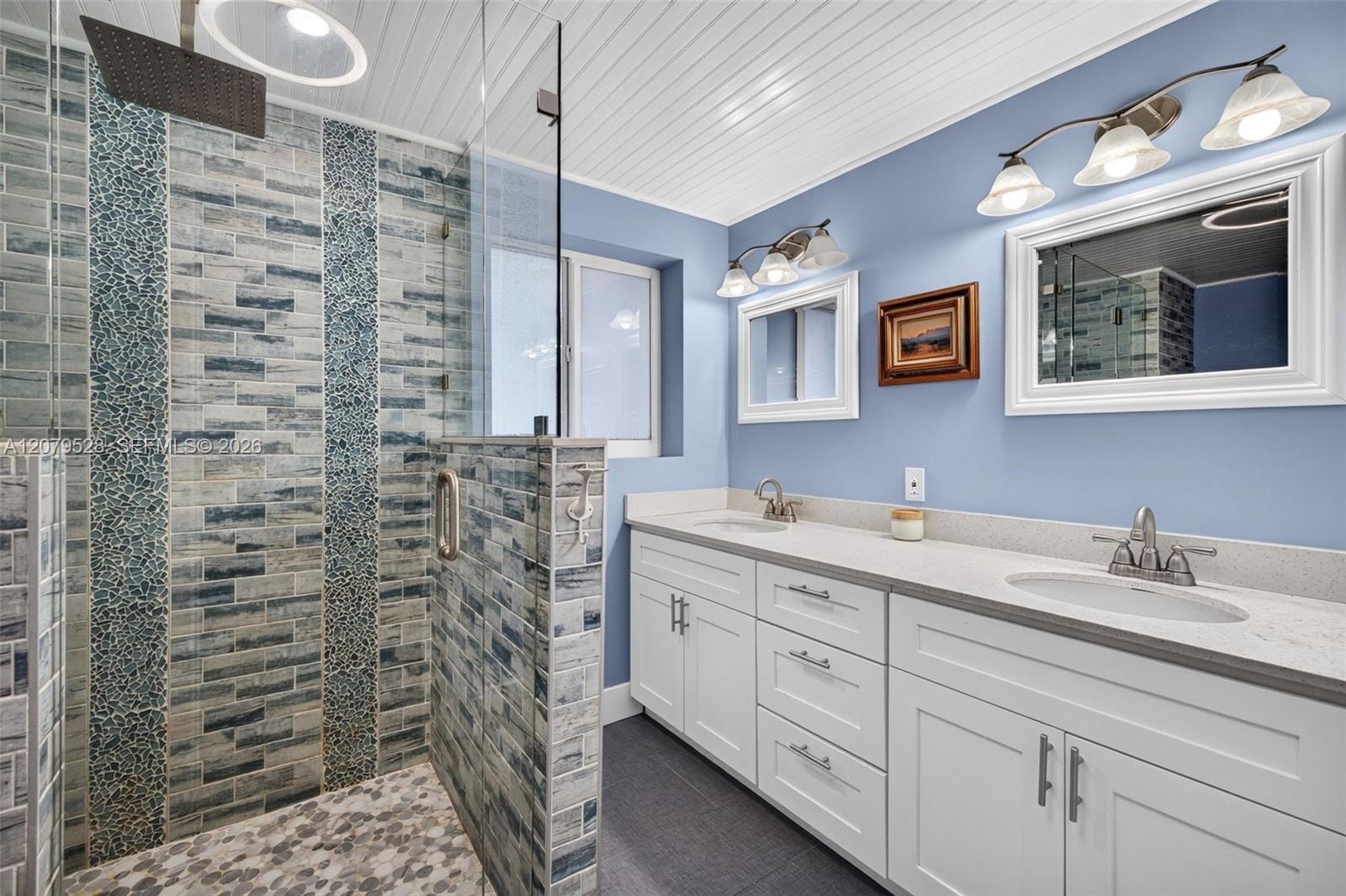 Oversized primary bedroom w/ beamed ceiling, Plantation Shutters and large walk in closet, en suite bathroom, on main level