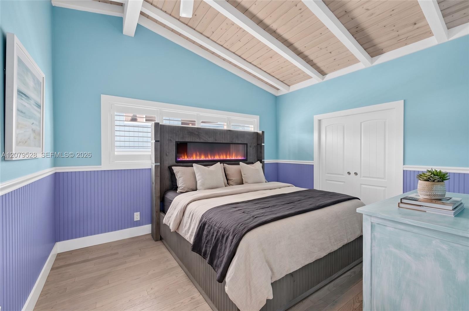 Great room or Dining Room downstairs, off kitchen, beyond this space is bedroom #4. Beachy paneled walls