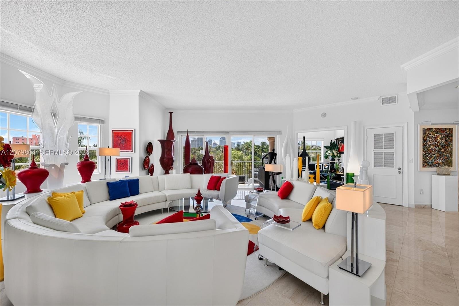 Part of unit 303. Bright / Modern Unit w/ all Marble Flooring, views to Downtown, Impact Windows & Doors. This is a large living room.