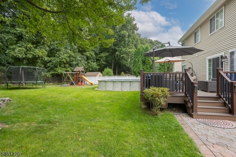 BACKYARD W/WOODED BACKDROP