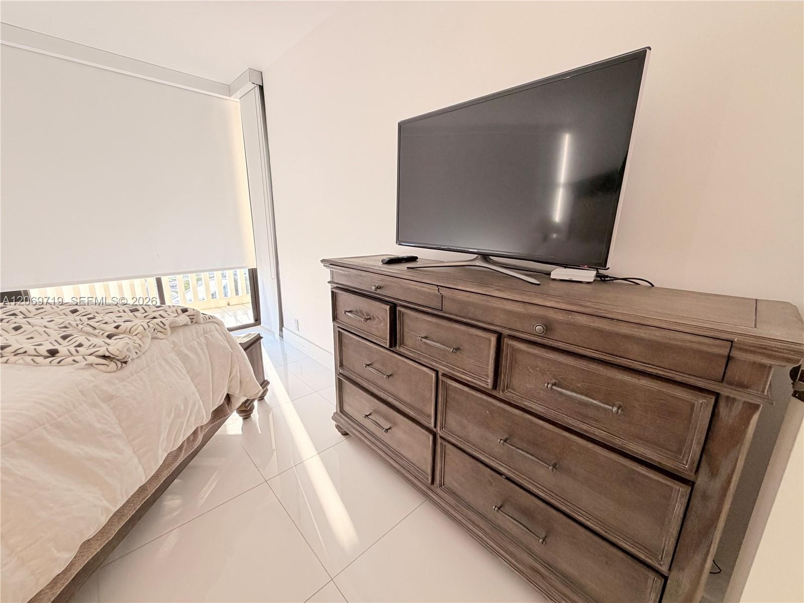 Bedroom #2 with plenty of storage and TV.