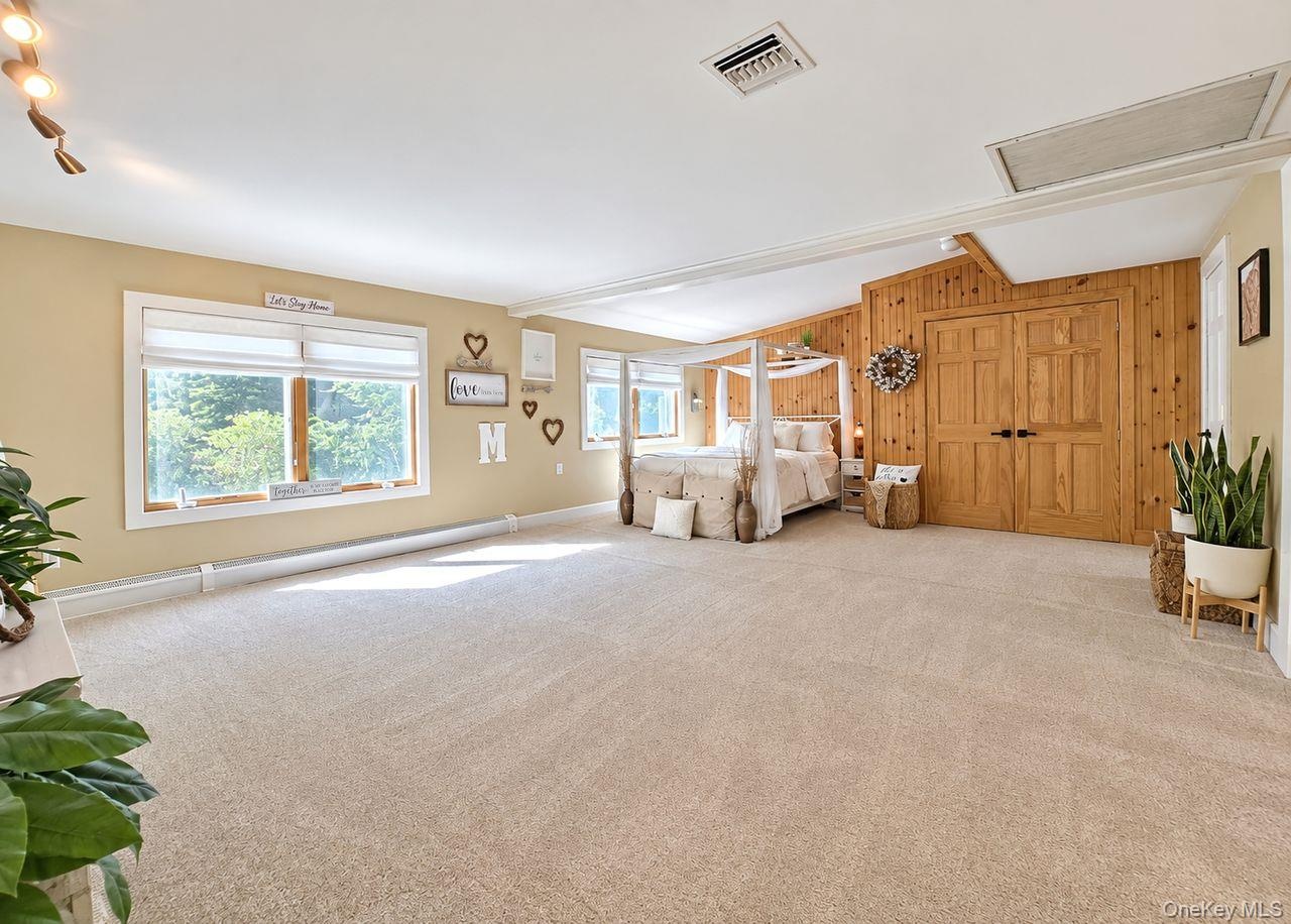 Expansive 2nd story primary bedroom, a private retreat