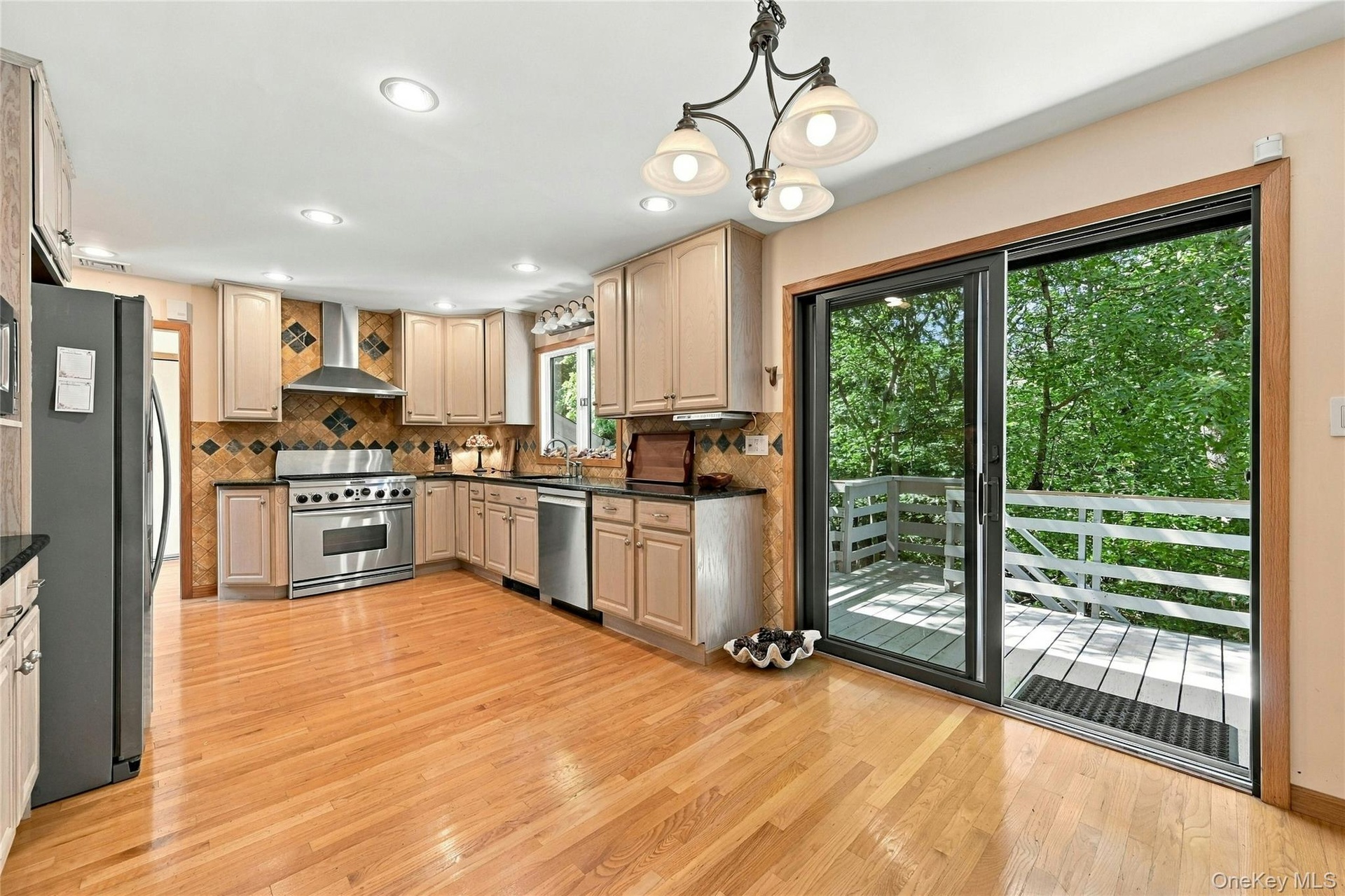 Kitchen with Sliding Door to Wrap Around Balcony