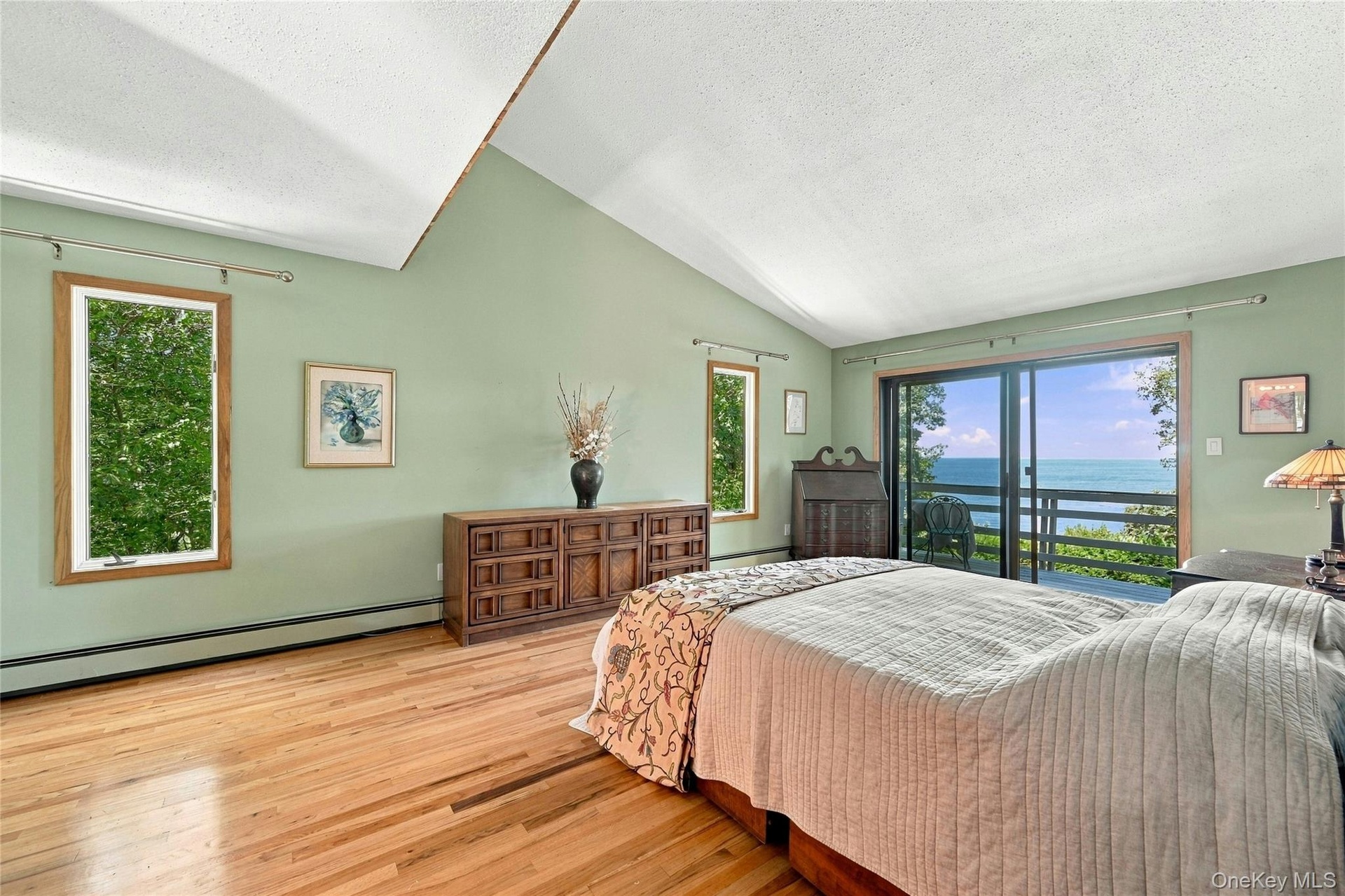 Primary Bed with Sliding Doors to Private Balcony and Water Views