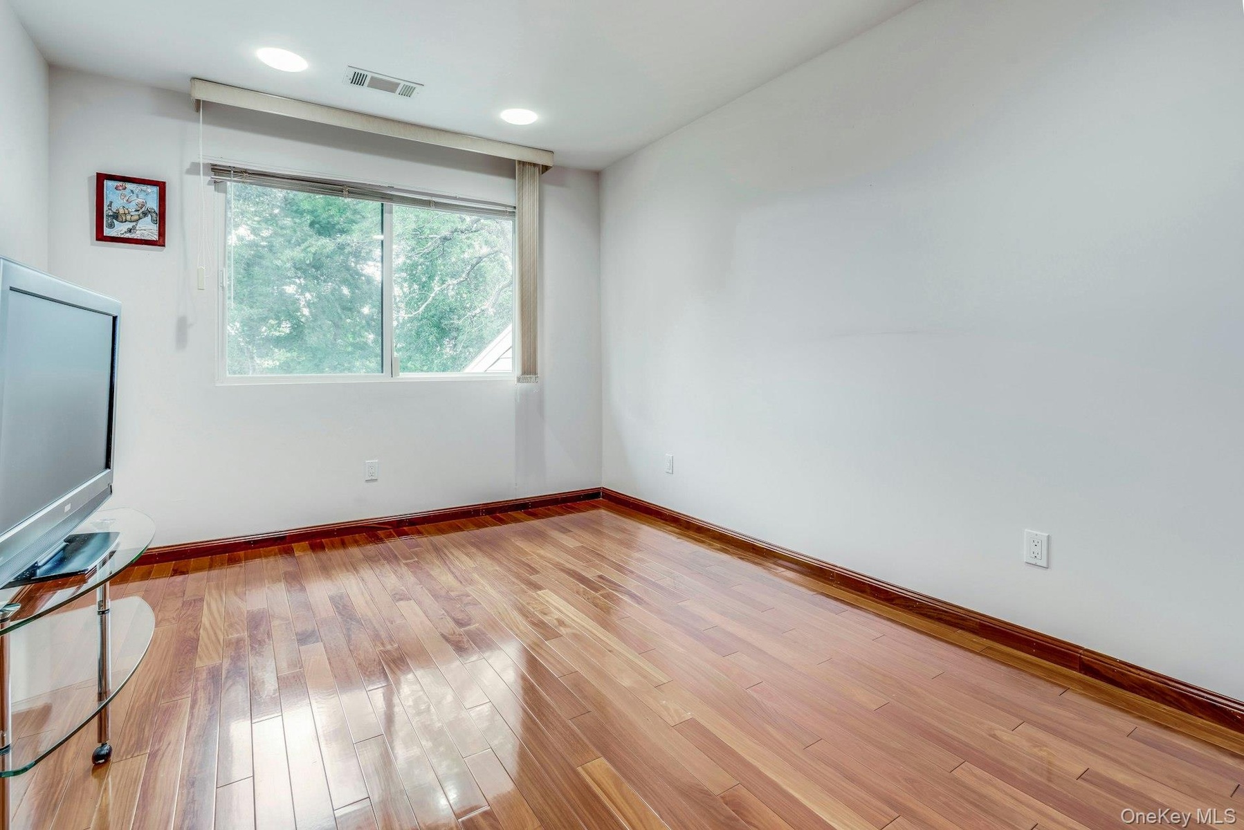 Bedroom with wood floors