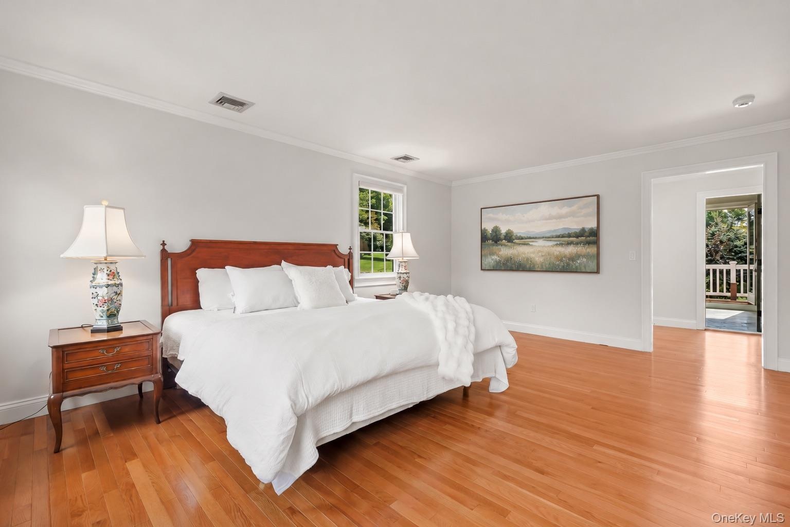 Primary Bedroom with En-Suite Bath and Two Large Walk-In Closets