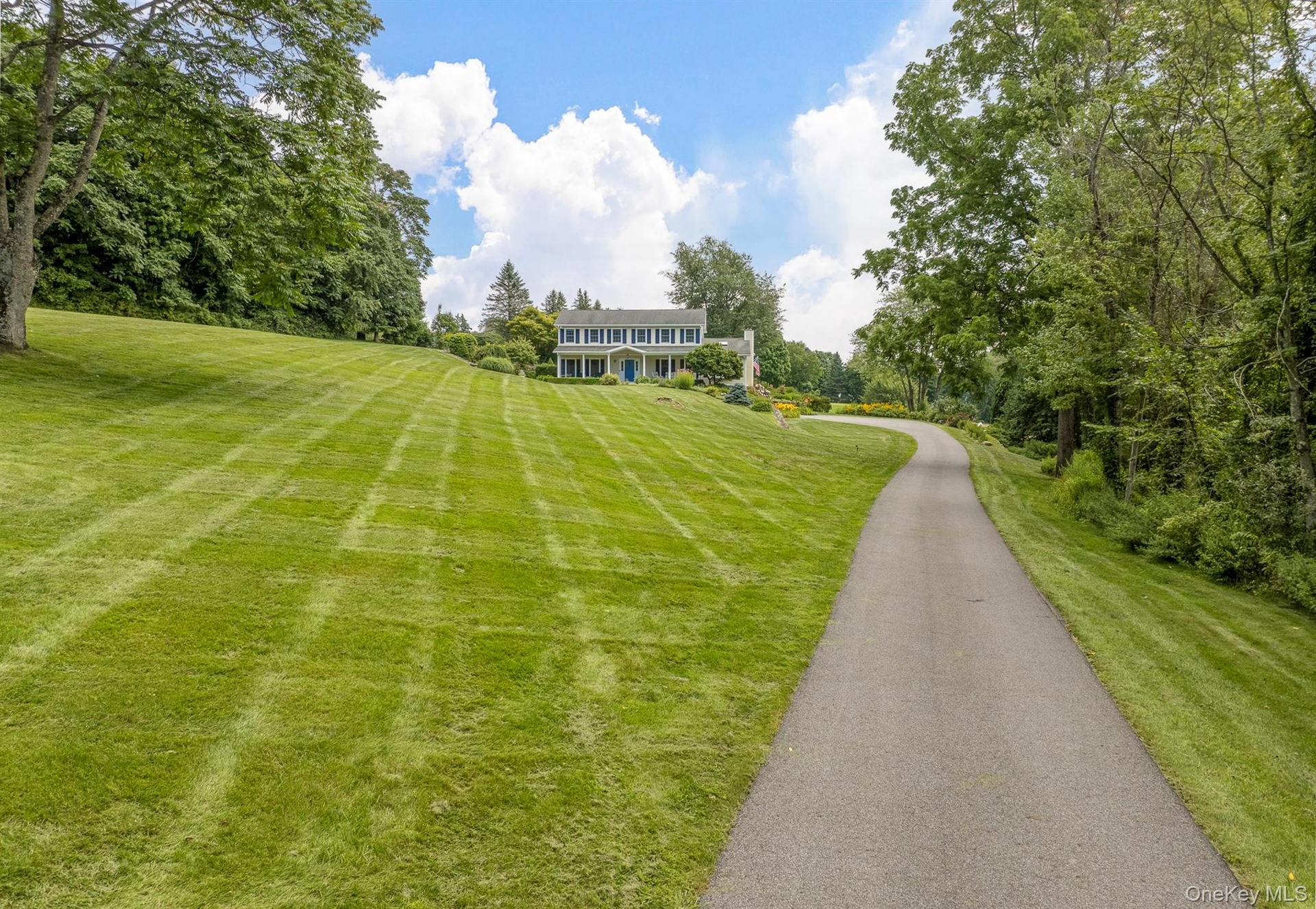Home is set back far from the Road down a Long Paved Driveway