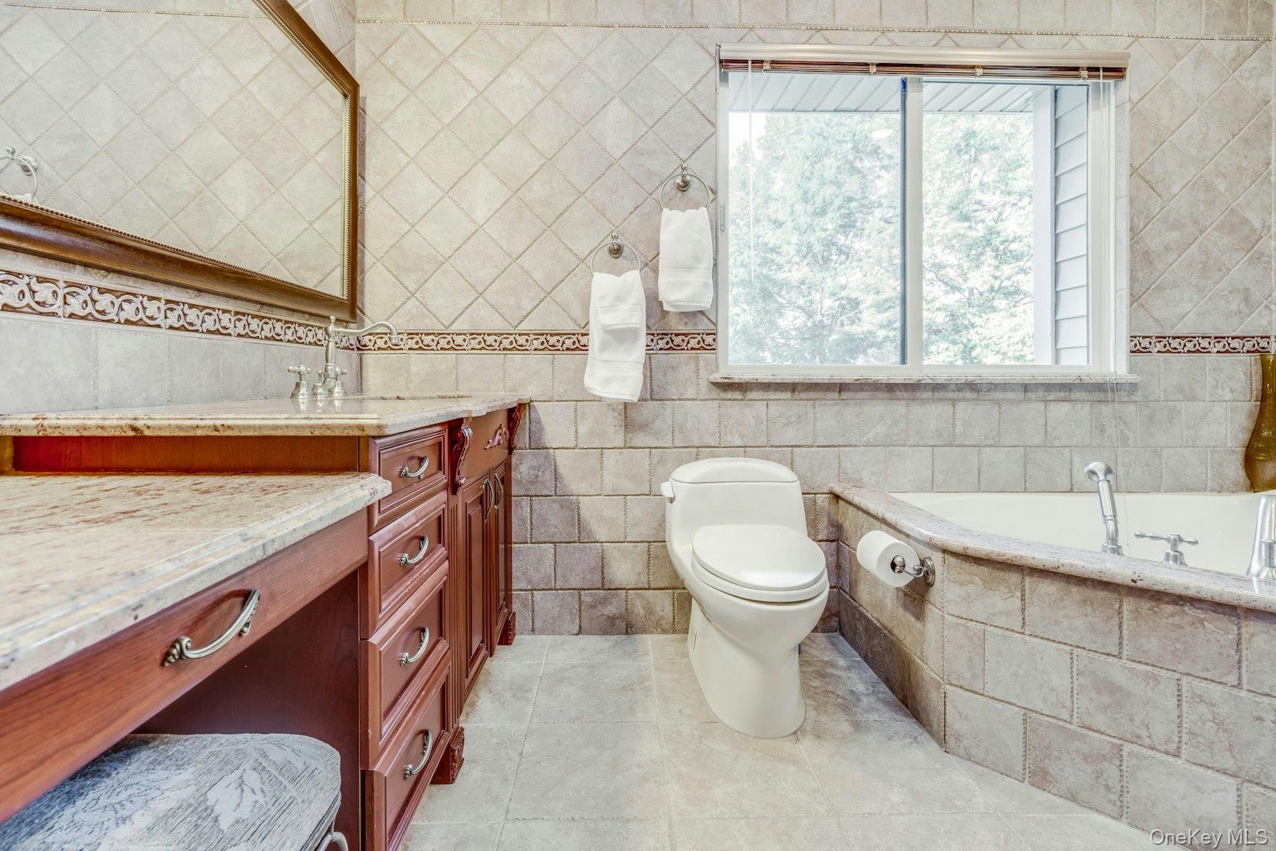 Jetted tub, walk in shower, granite vanity