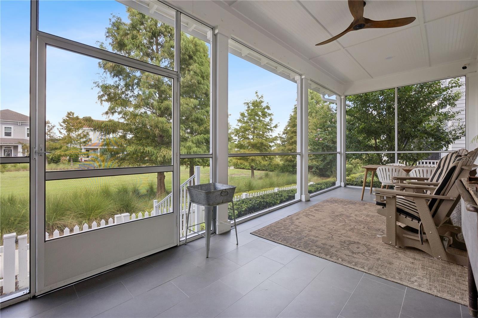 Welcoming screened porch overlooking park!