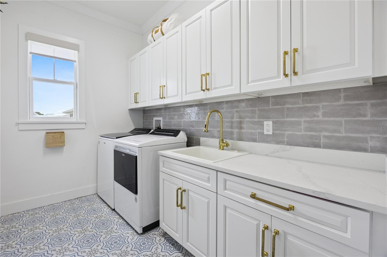 First floor laundry with designer tile