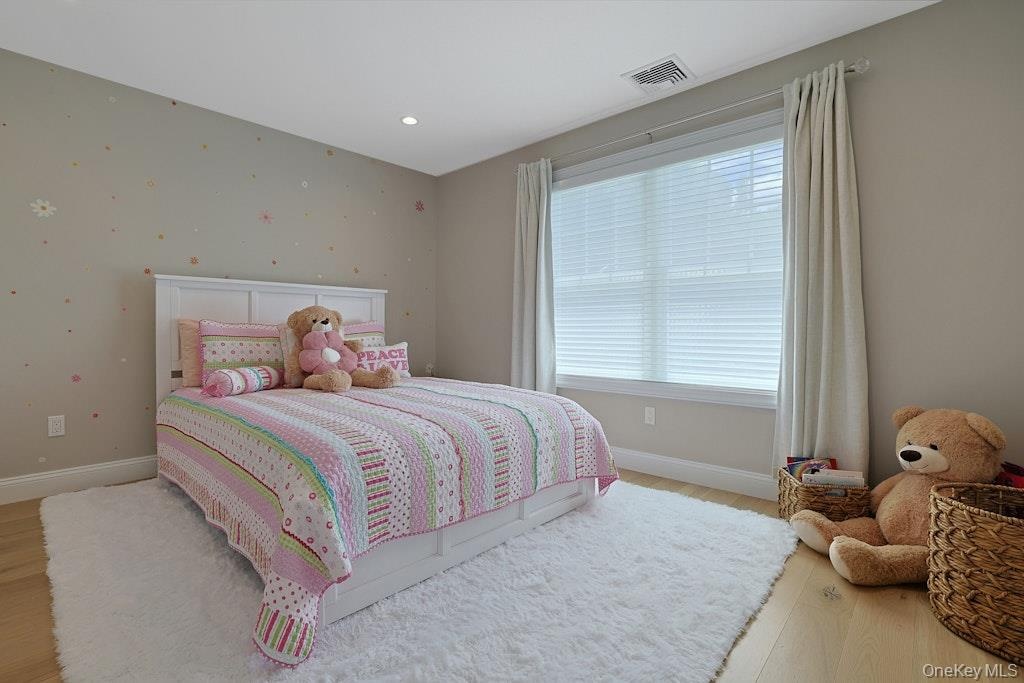 Bright spacious bedroom located on the second level