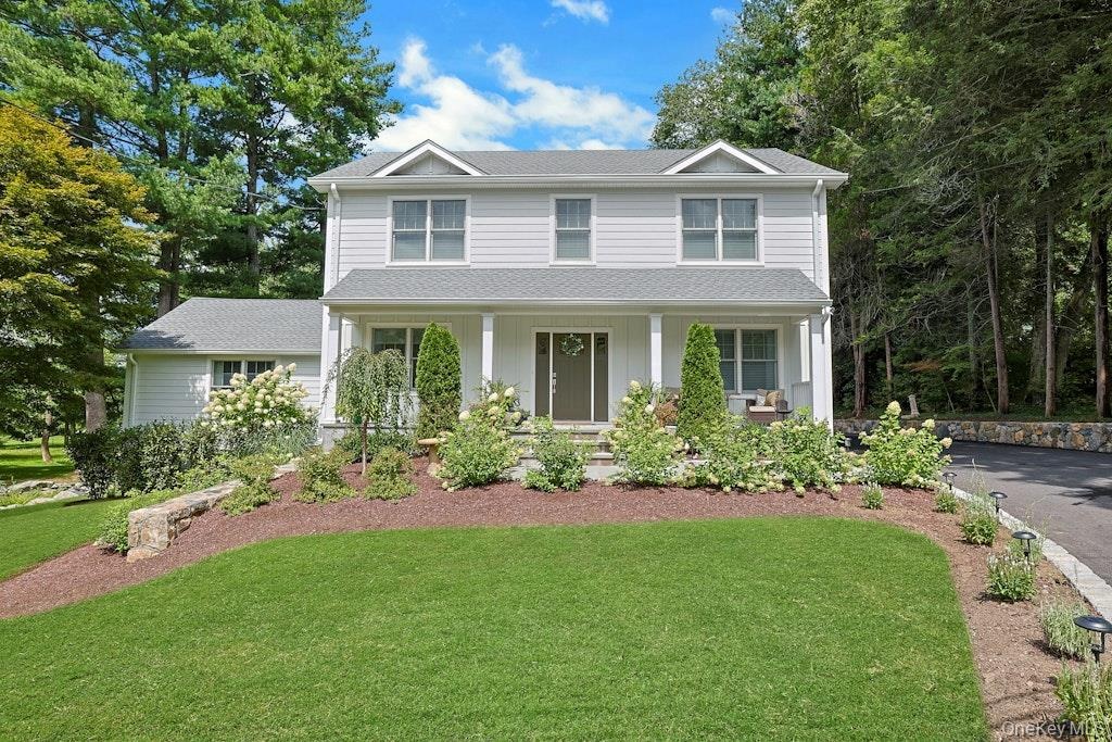 Beautiful curb appeal! welcomes you home, complete with a charming front porch, the perfect spot to enjoy your morning coffee and star the day in a pe