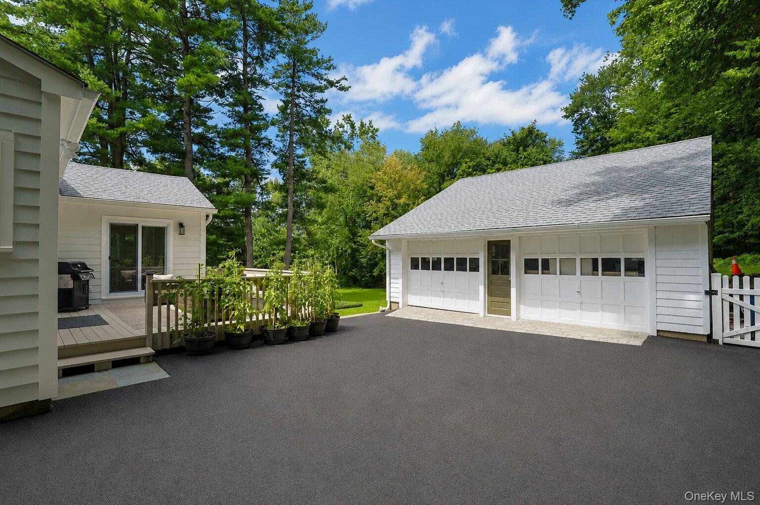 View of the deck and this large driveway!