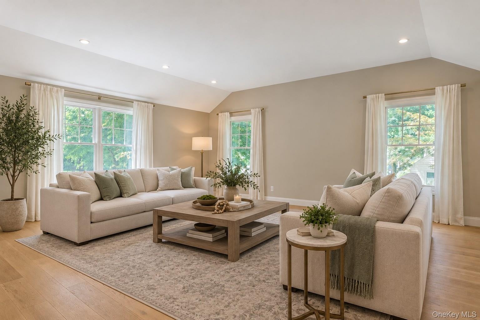 Bright, and spacious family room featuring and abundance of windows that fill the space with natural light, creating a warm and inviting atmosphere.