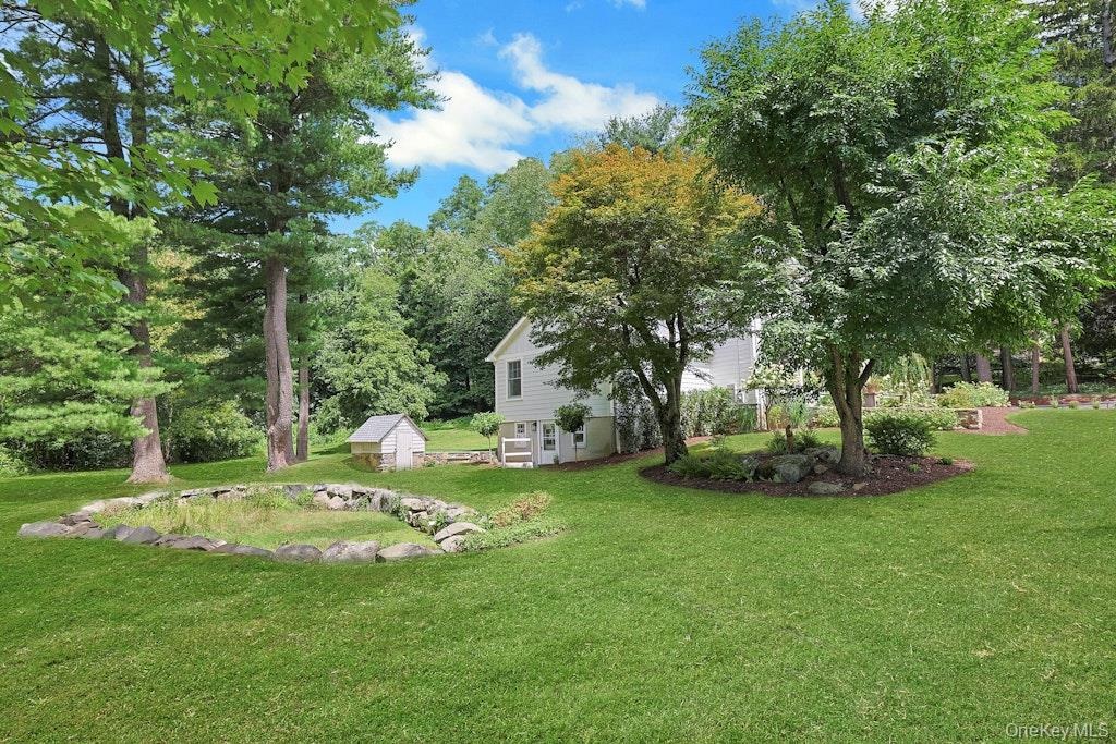 Beautiful, level lawn offering plenty of space for outdoor fun, playtime, and children's playground, the perfect level yard!