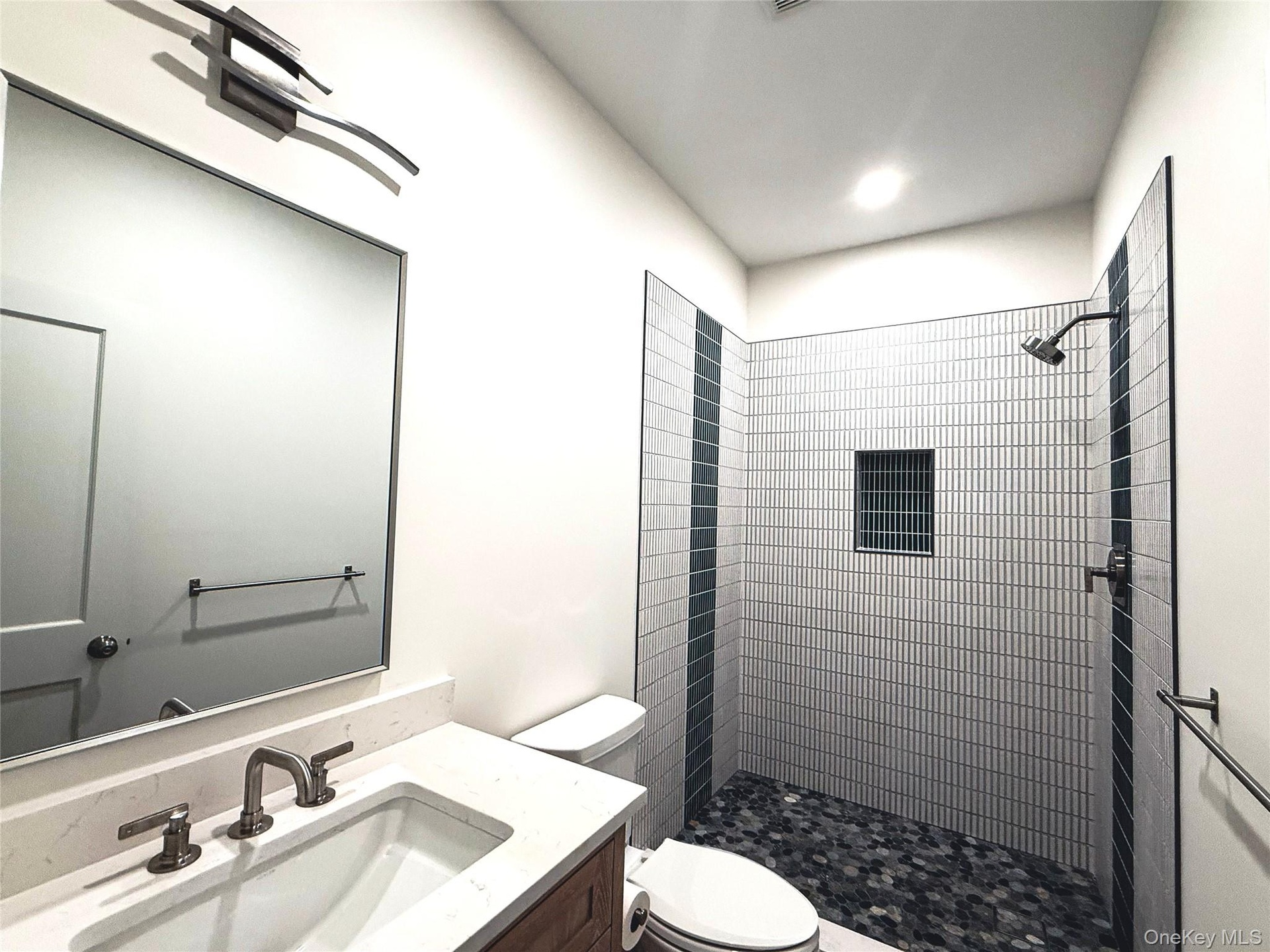 Sink with vanity and stall shower