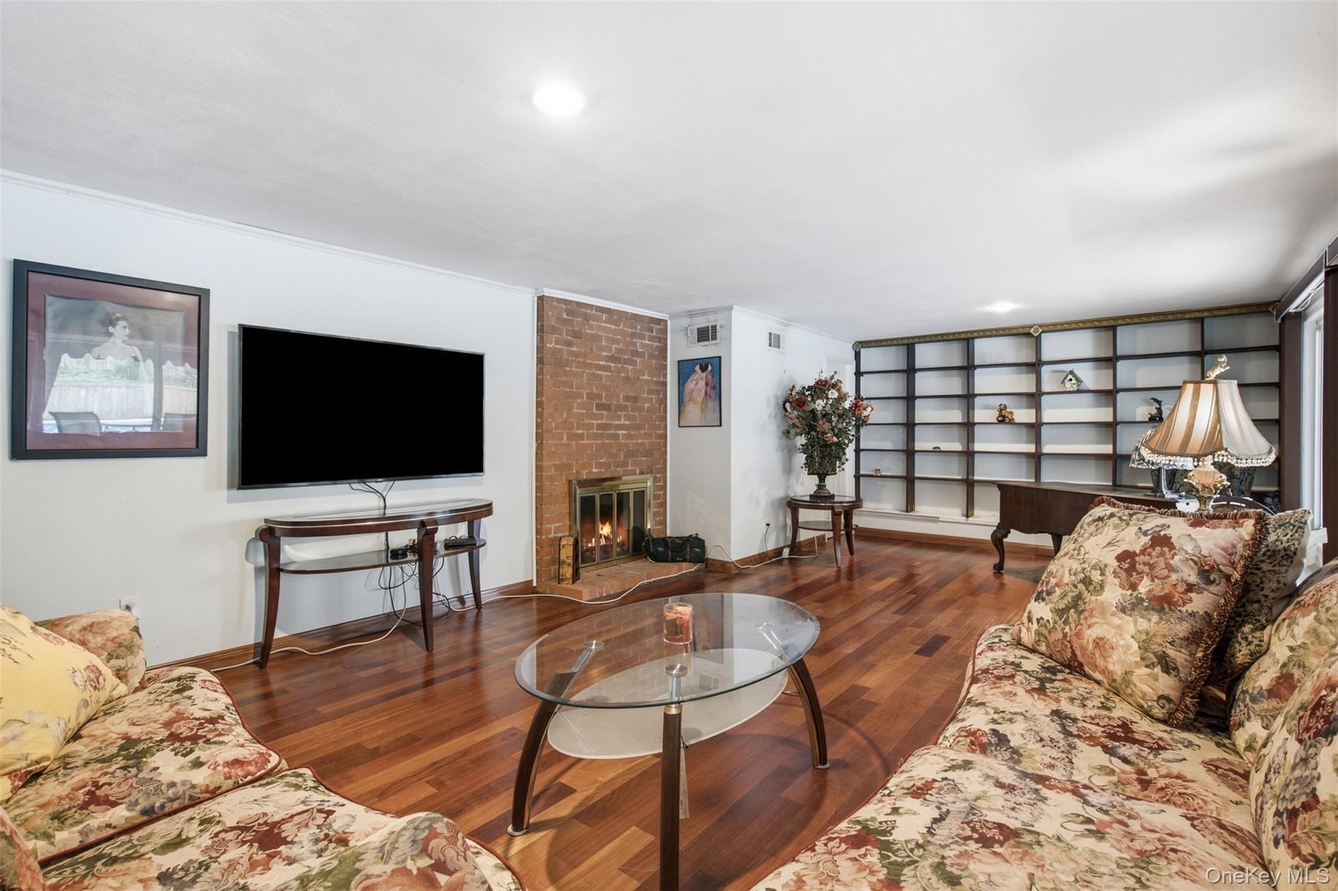 Spacious Family Room With Fireplace and Built In Bookcase