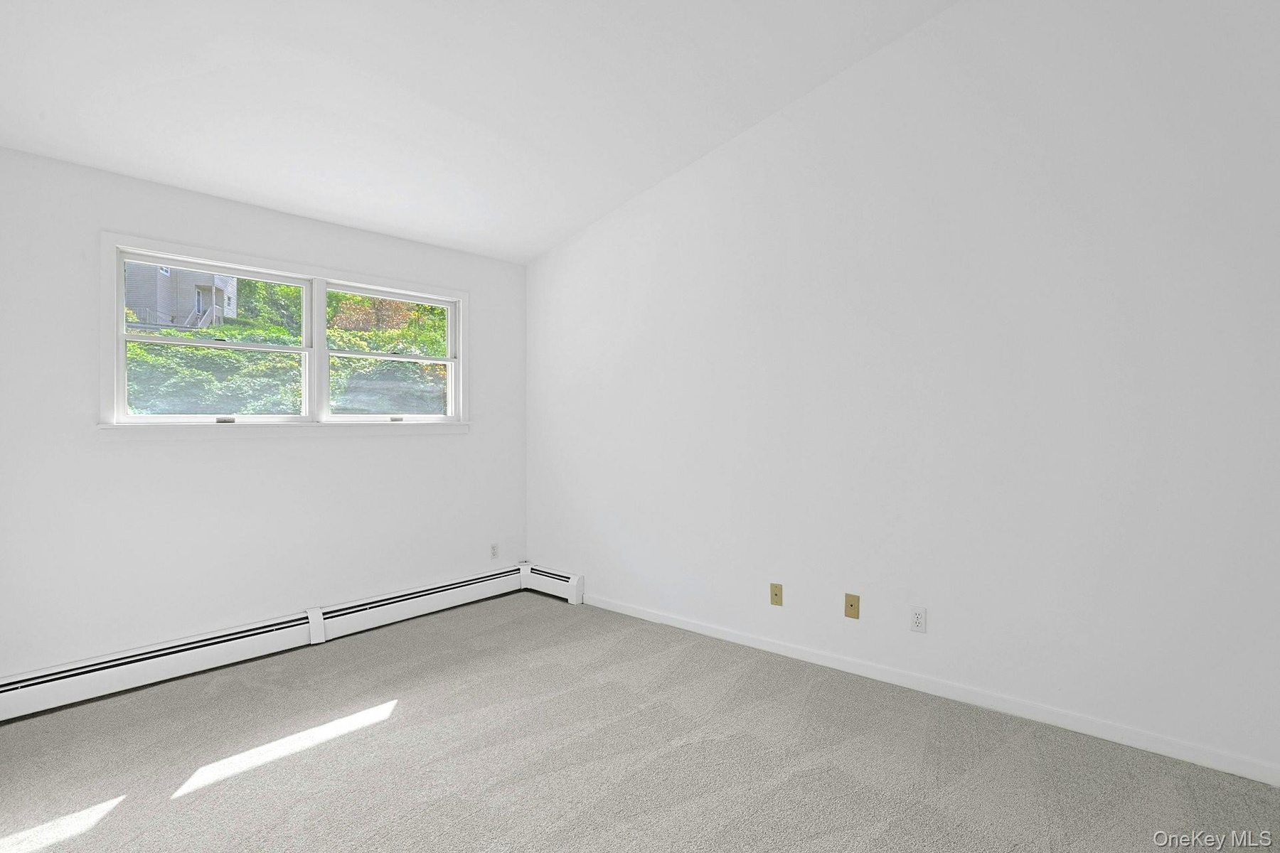 The second bedroom has windows out to the front of the home, large closets of its own and, best of all, its own private bathroom!