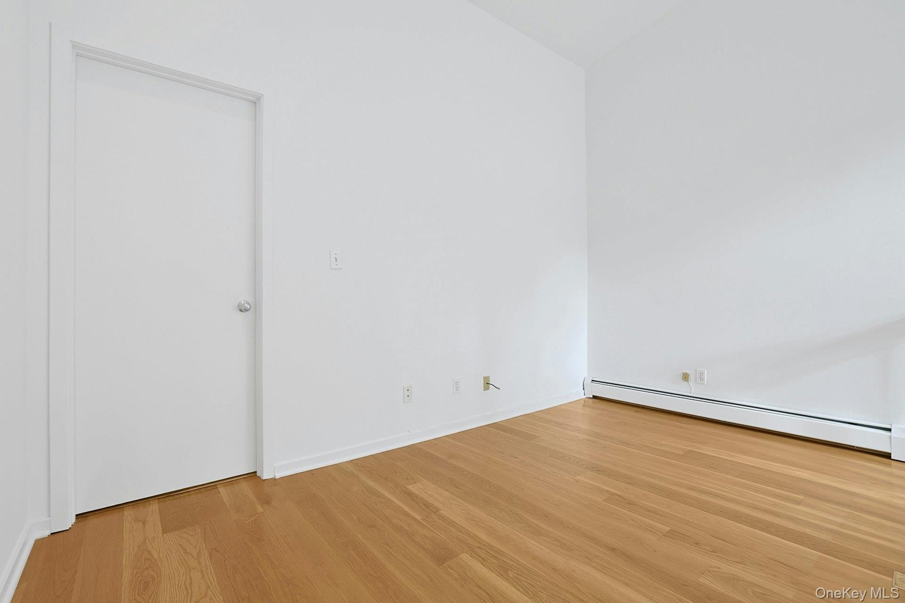 The loft would make for a great home office, library or den. The door on the left opens to the primary bedroom.