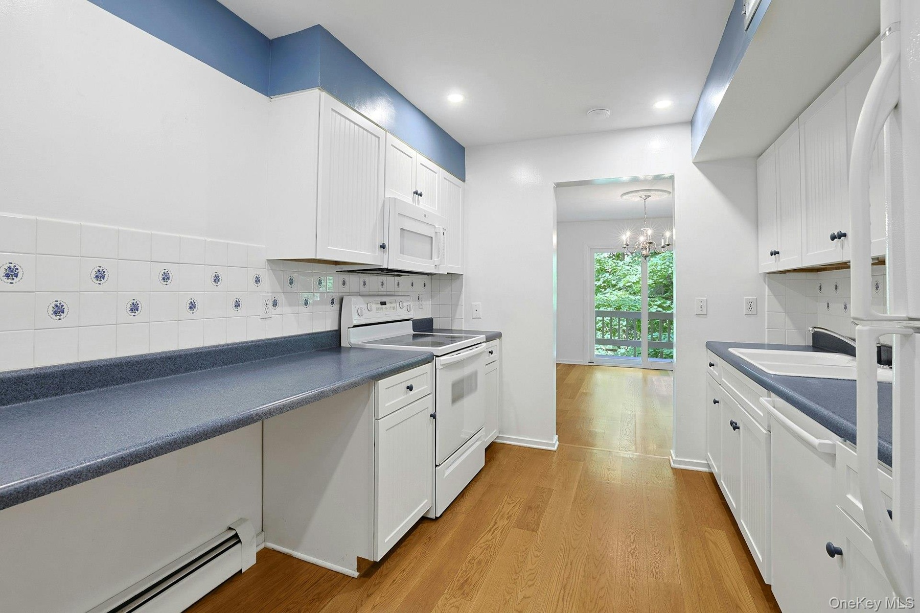The counter on the left allows for both extra storage below, or better accessibility for differently abled.