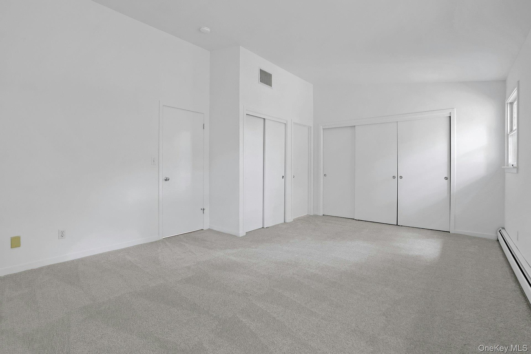 Extensive closets in the primary bedroom make storage easy. There is space for every season.